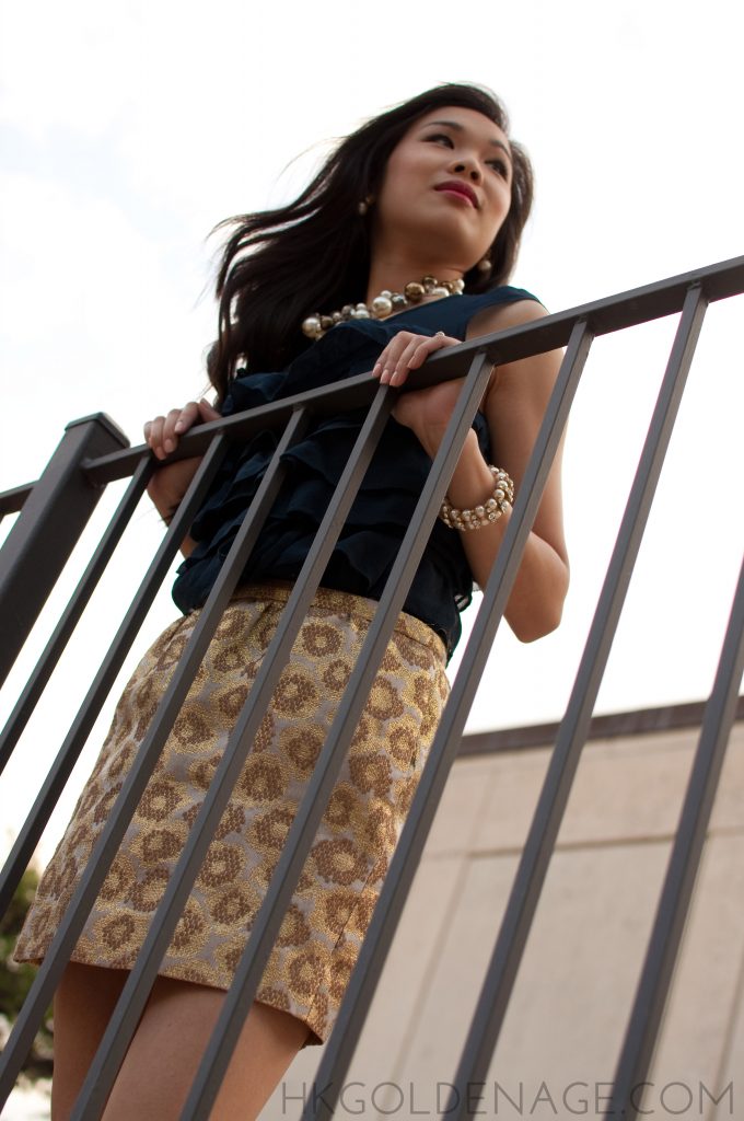 Brocade skirt with ruffled top and gold accessories