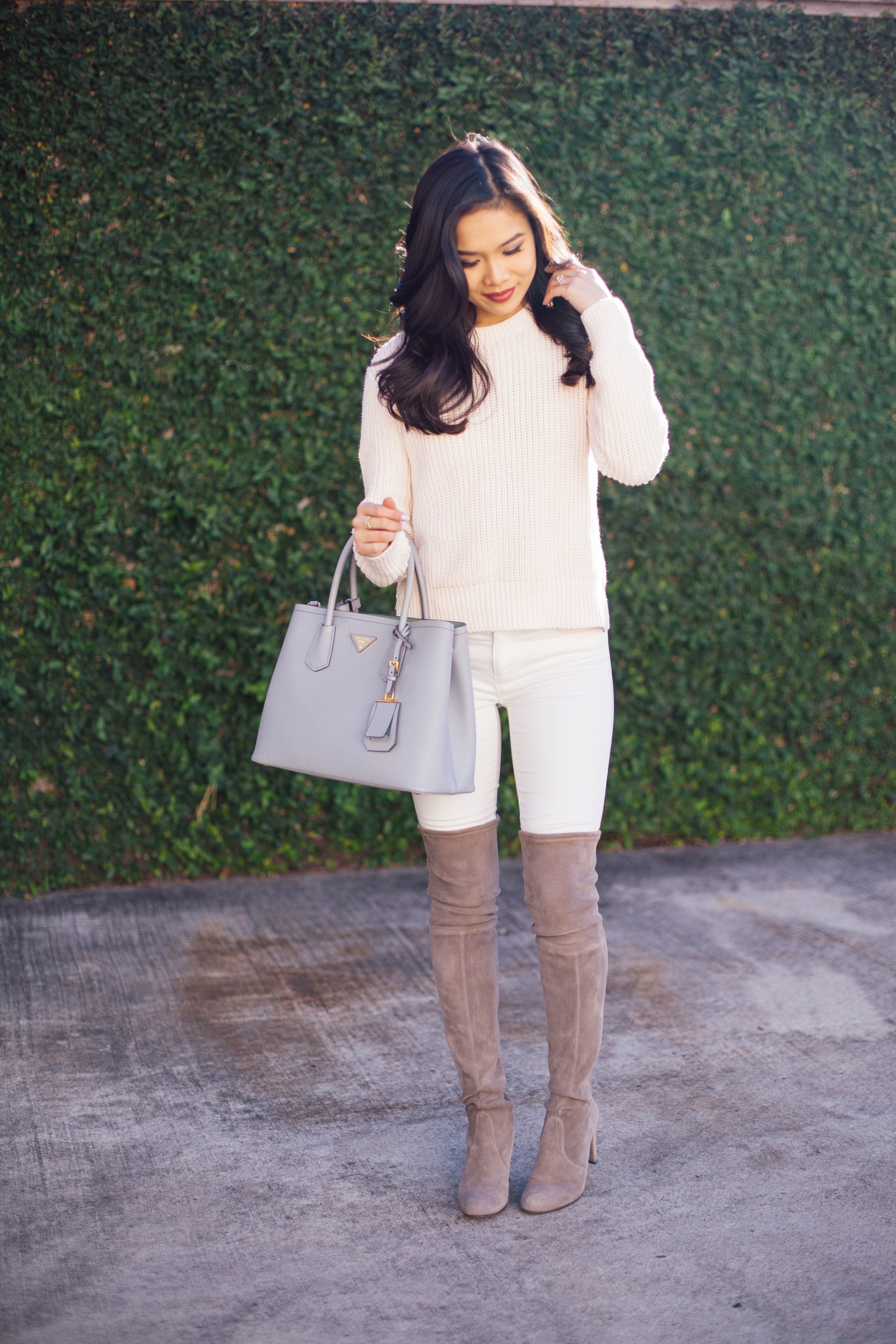 Winter neutrals with a powder pink sweater and Stuart Weitzman highland boots in topo suede.