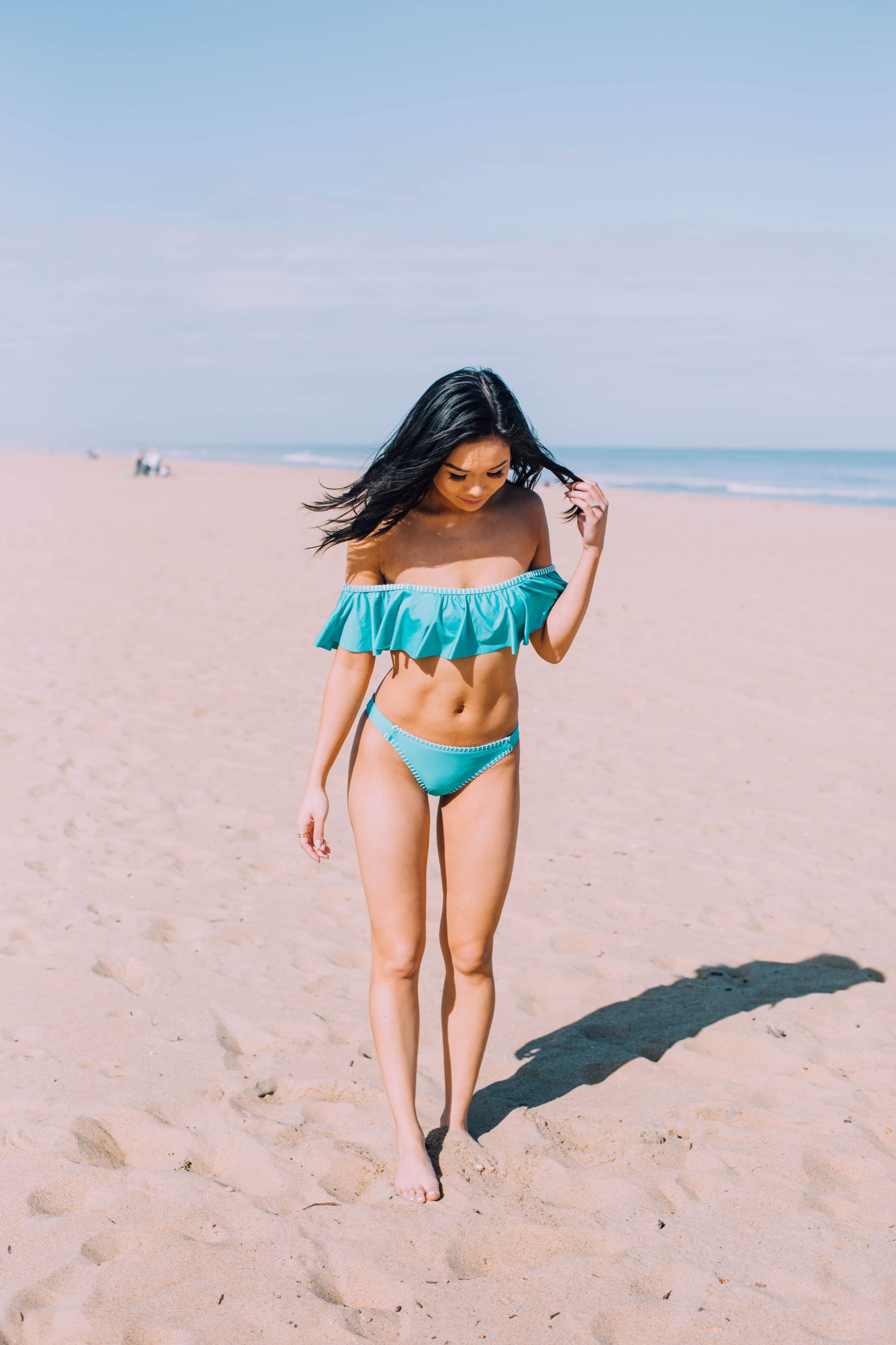 Blogger Hoang-Kim catches some rays in a Splendid stitch off the shoulder ruffle bikini at Virginia Beach