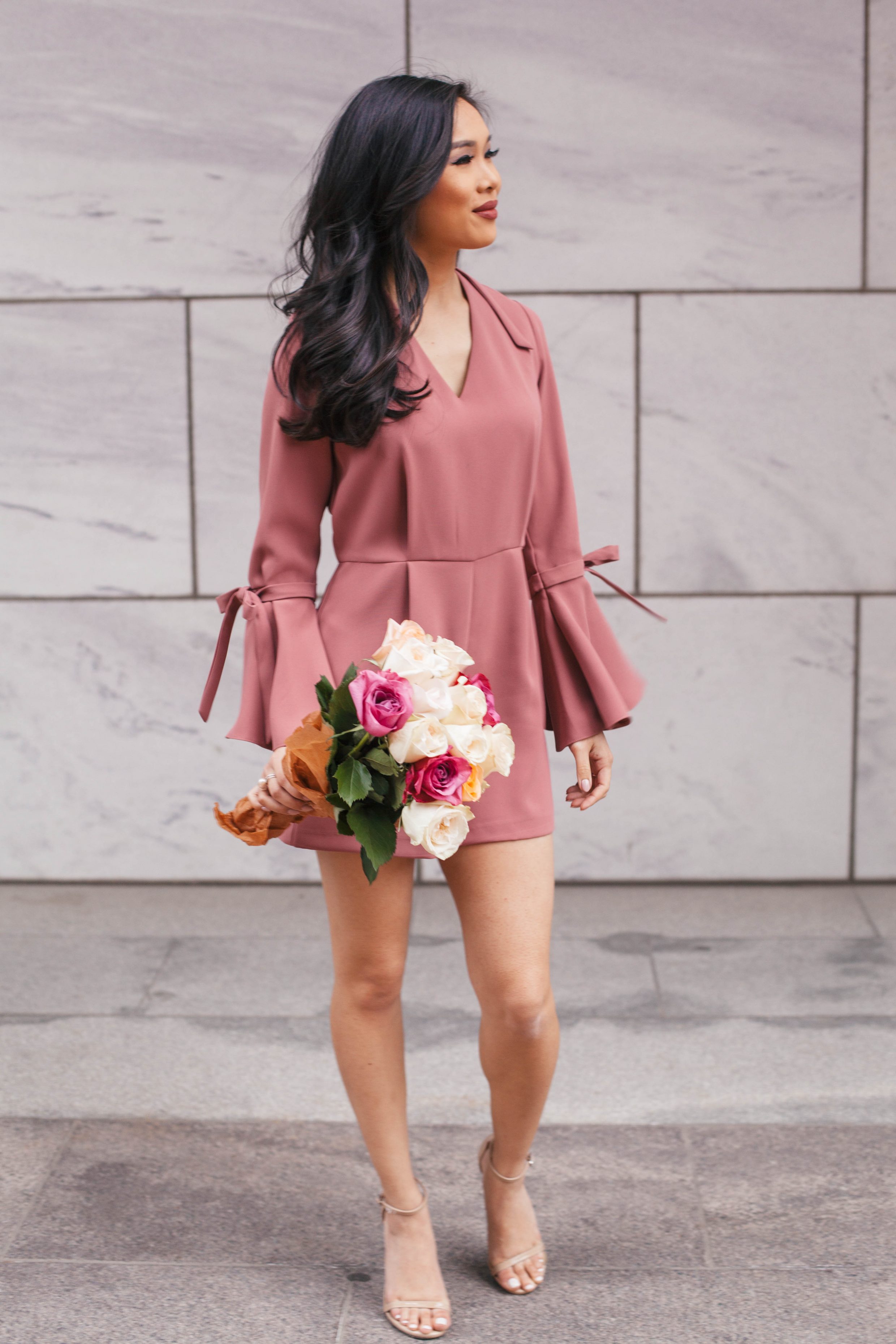 Blogger Hoang-Kim wears a trumpet sleeve romper with Trollbeads jewelry