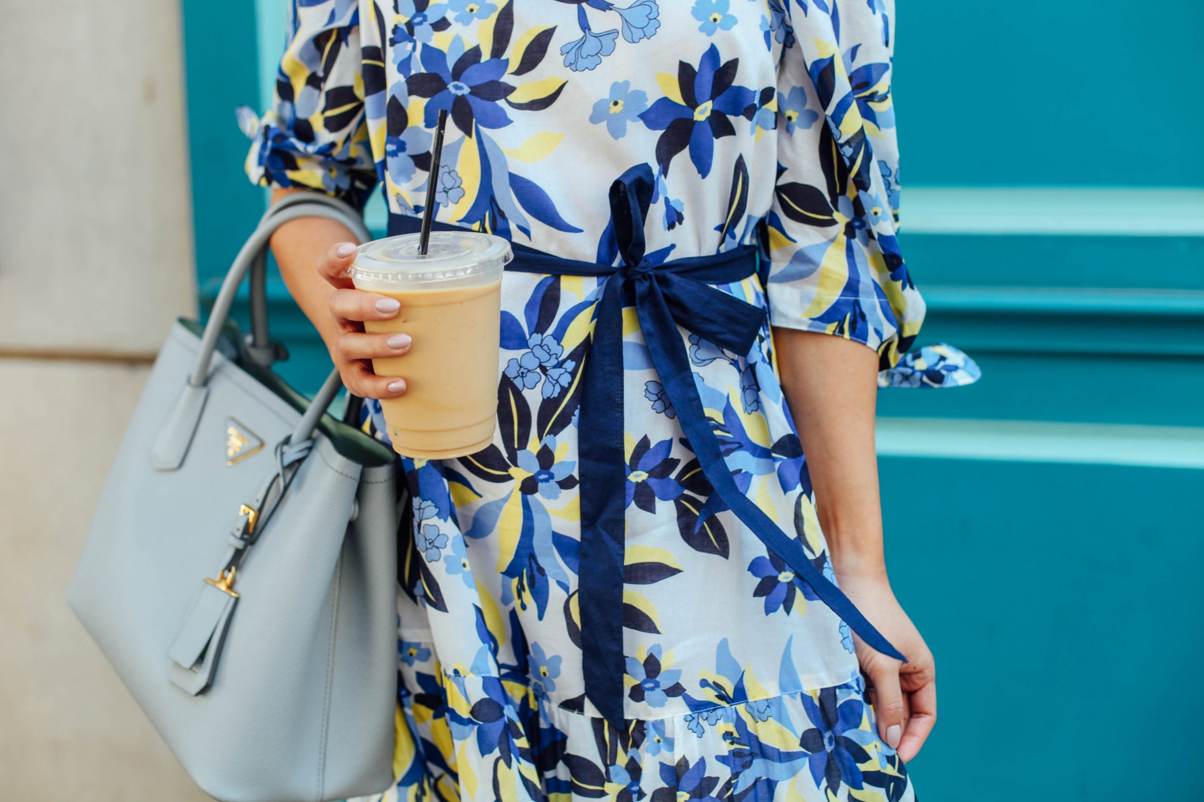 Hoang-Kim wears a blue floral off the shoulder dress, the epitome of southern charm