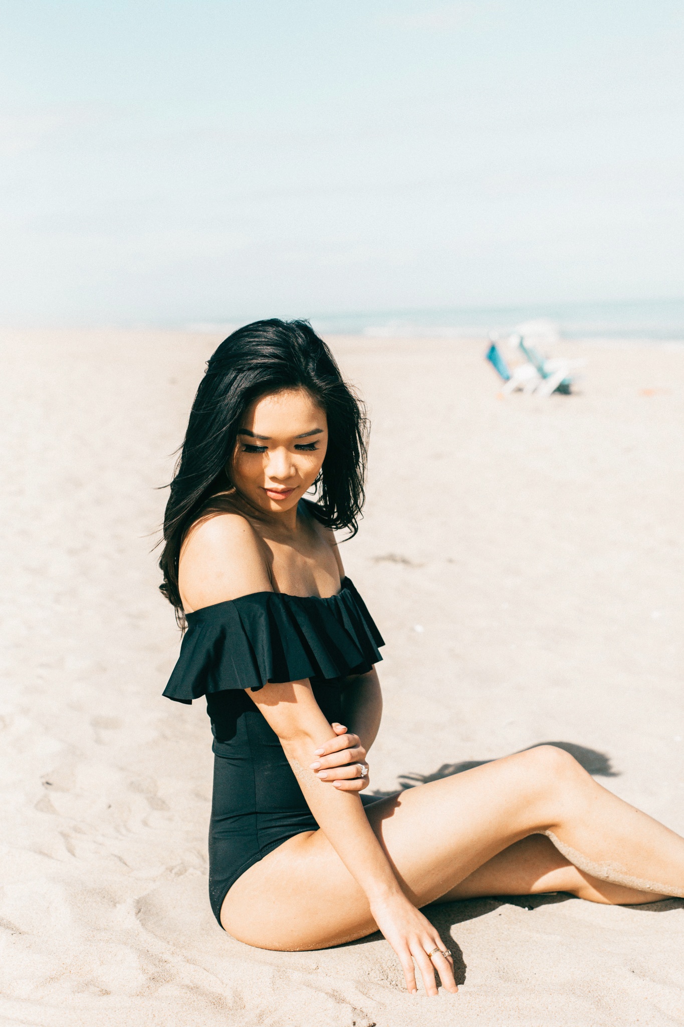 black off the shoulder one piece swimsuit with ruffles