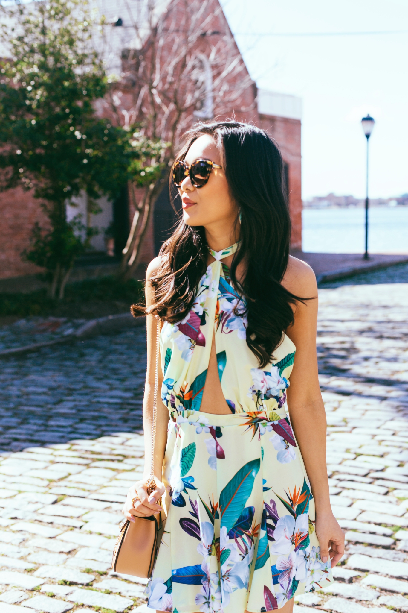 Blogger Hoang-Kim wears the Ocean Dress by 6 Shore Pooja in a paradise floral print in Norfolk, Virginia