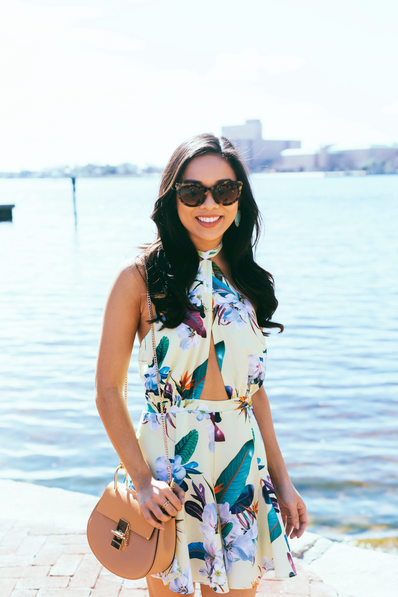 Blogger Hoang-Kim wears the Ocean Dress by 6 Shore Pooja in a paradise floral print in Norfolk, Virginia
