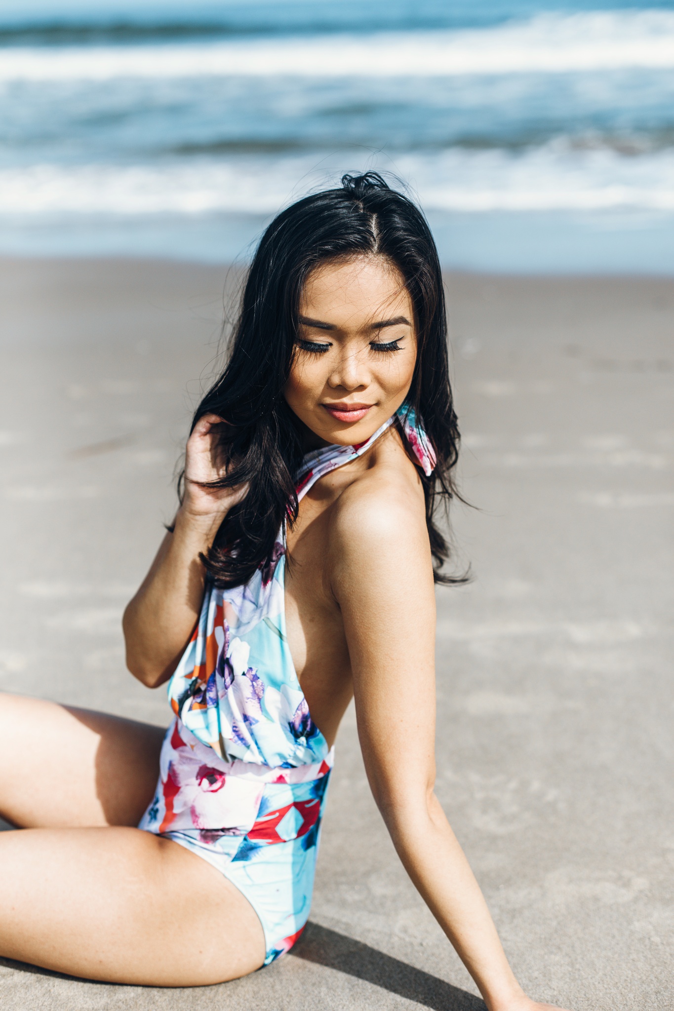 Hoang-Kim wears the cabana one-piece swimsuit by 6 Shore Road at the Oceanfront in Virginia Beach