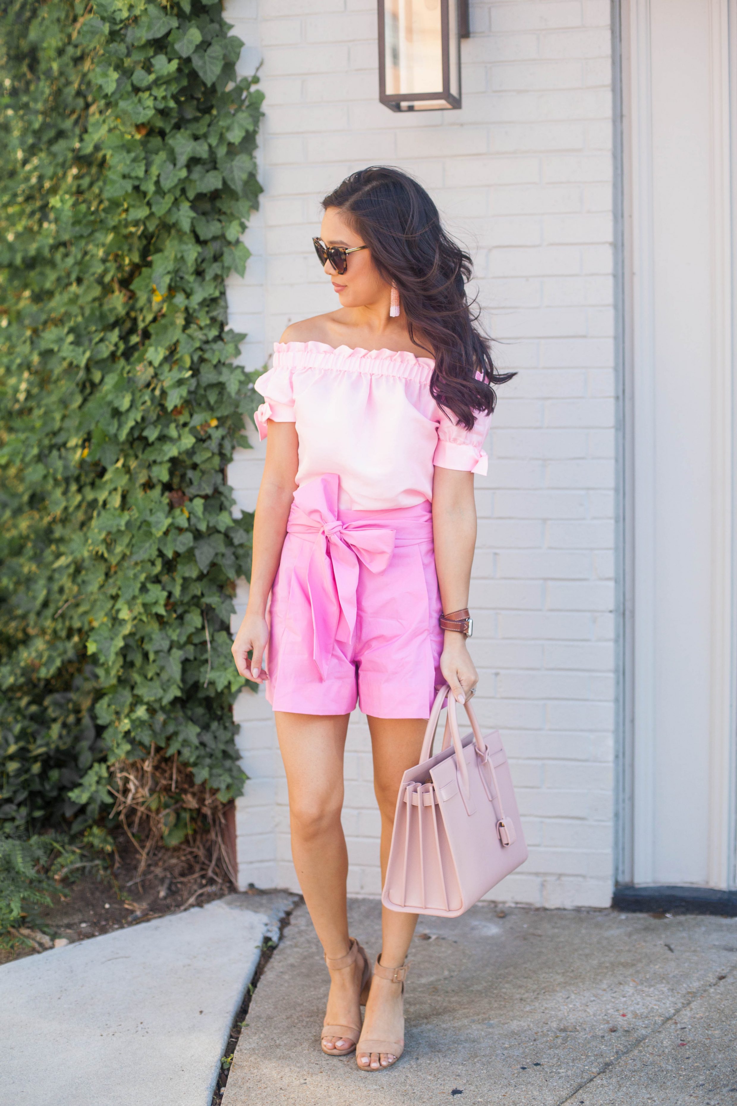 COLOR & CHIC | Pink off the shoulder top and pink bow tie shorts with Saint Laurent Sac de Jour