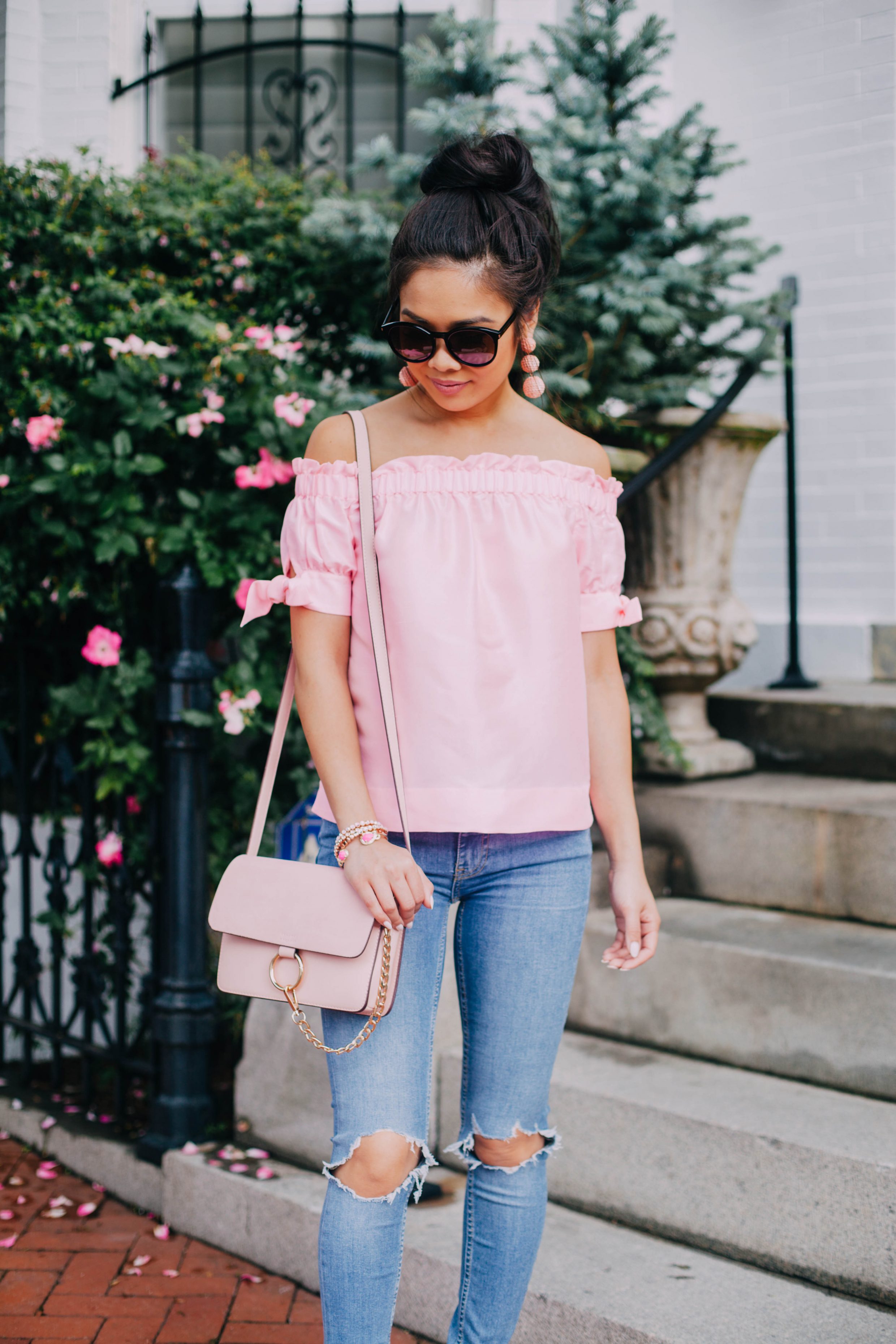 COLOR & CHIC | Pink silk off the shoulder top with distressed jeans