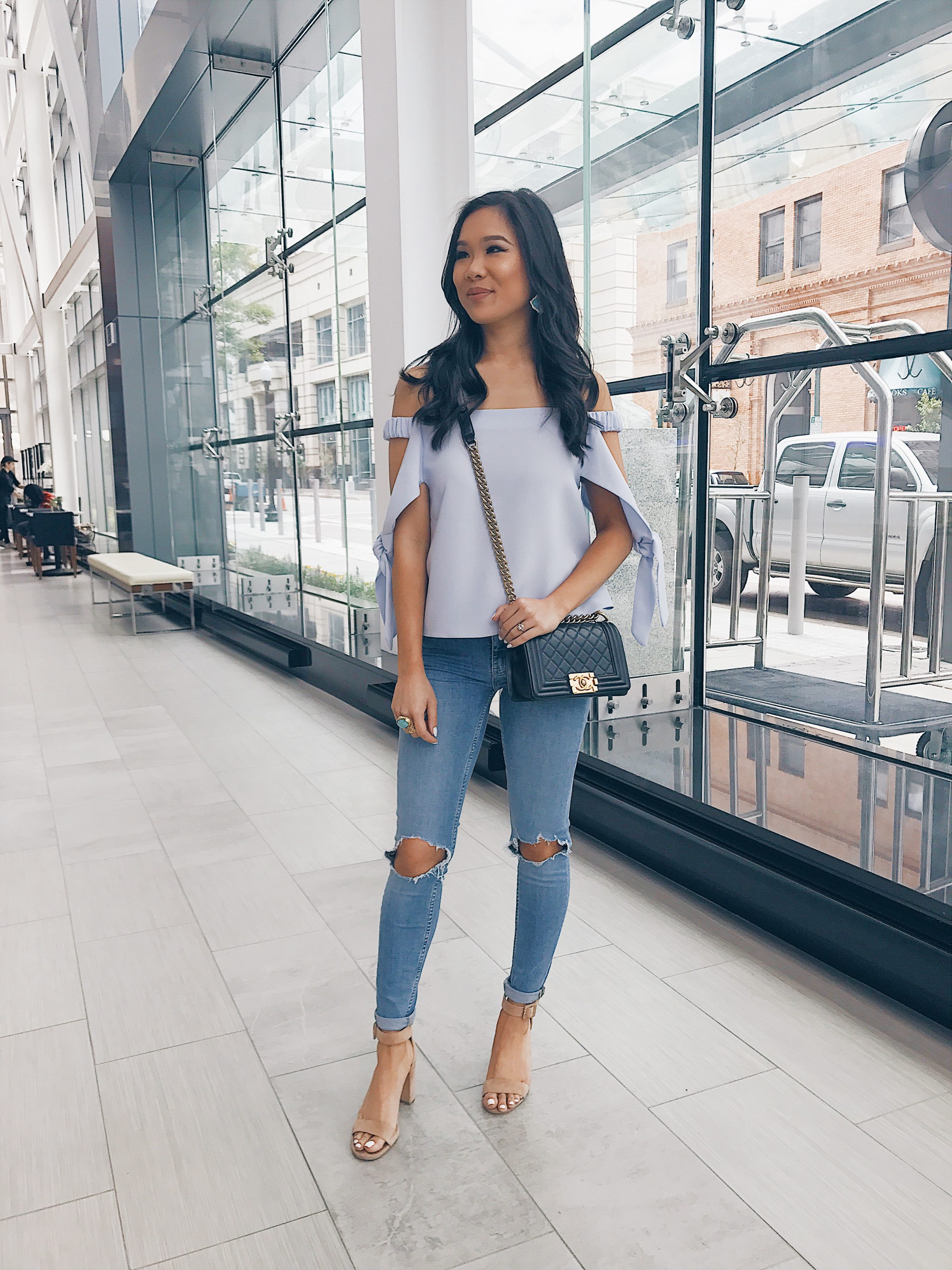 Blogger Hoang-Kim at Hilton Norfolk The Main in a Topshop bardot top, free people jeans and Ann Taylor heels with a Chanel bag