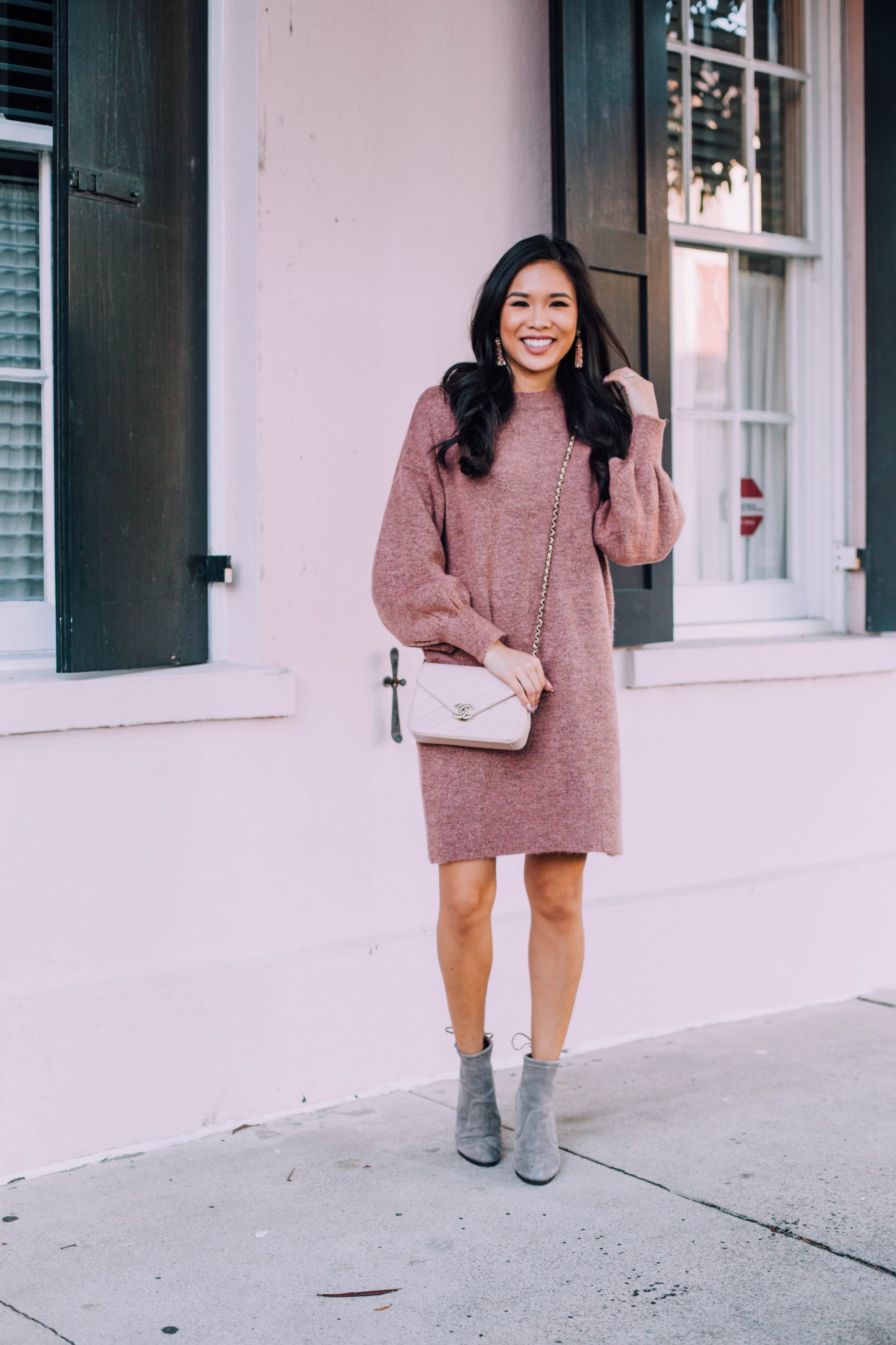 Mauve sweater dress and gray booties with Chanel bag and Baublebar tassel earrings