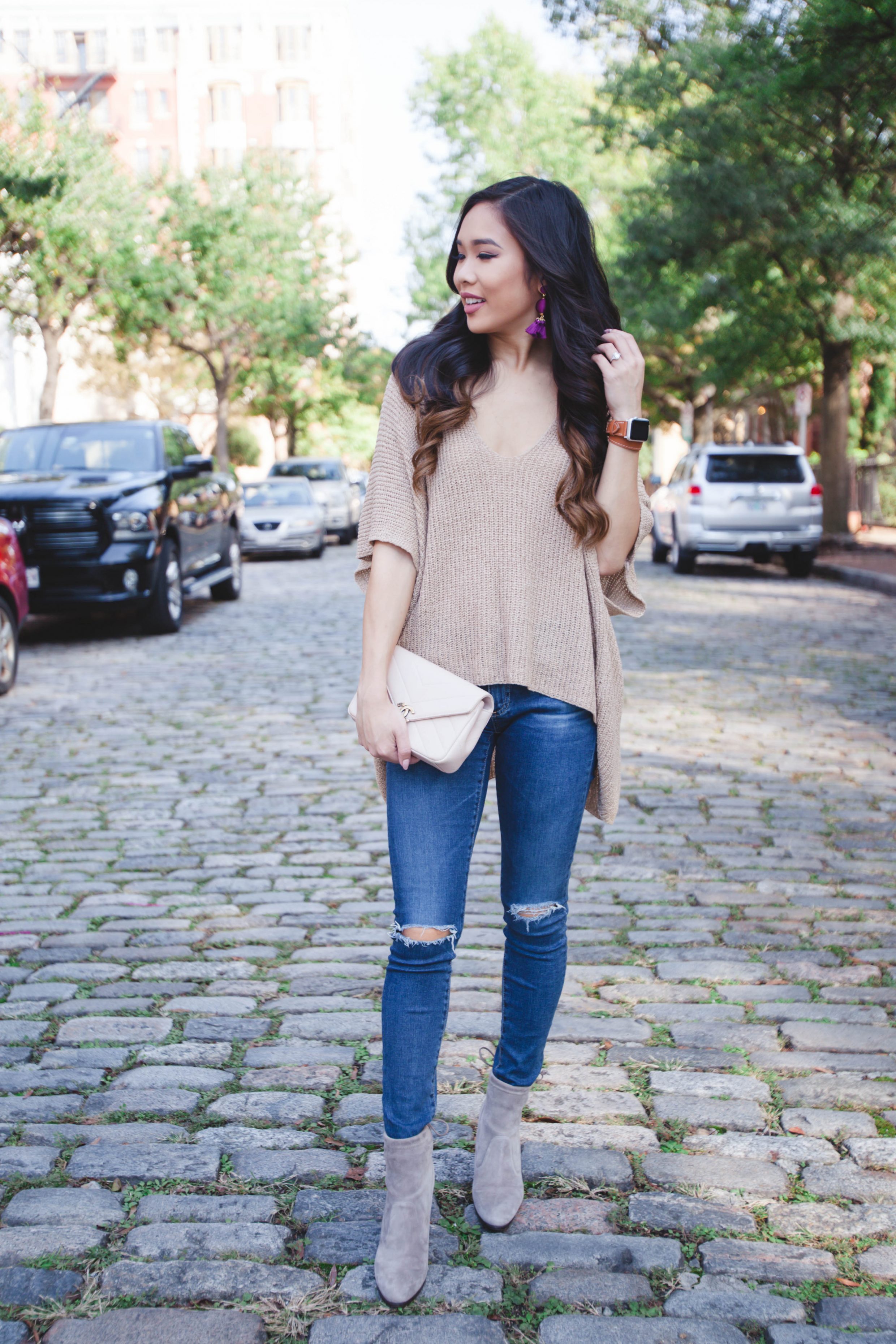 Tan lightweight sweater with plum earrings and Chanel bag
