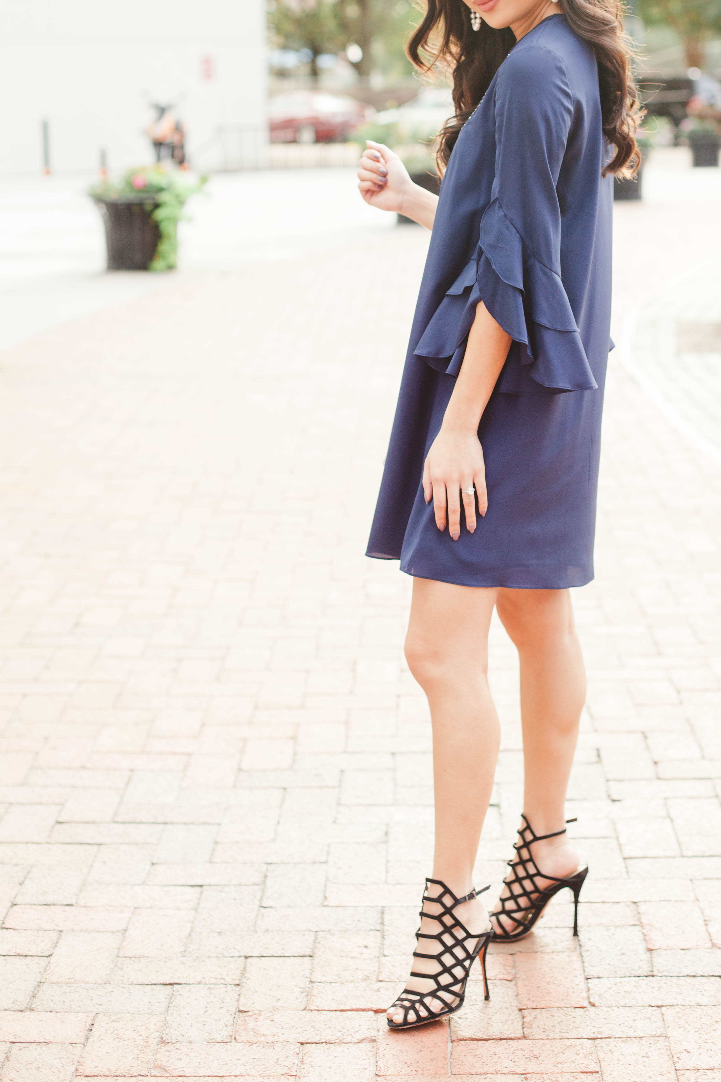 Navy blue silk tunic dress with layered sleeves and cage heels