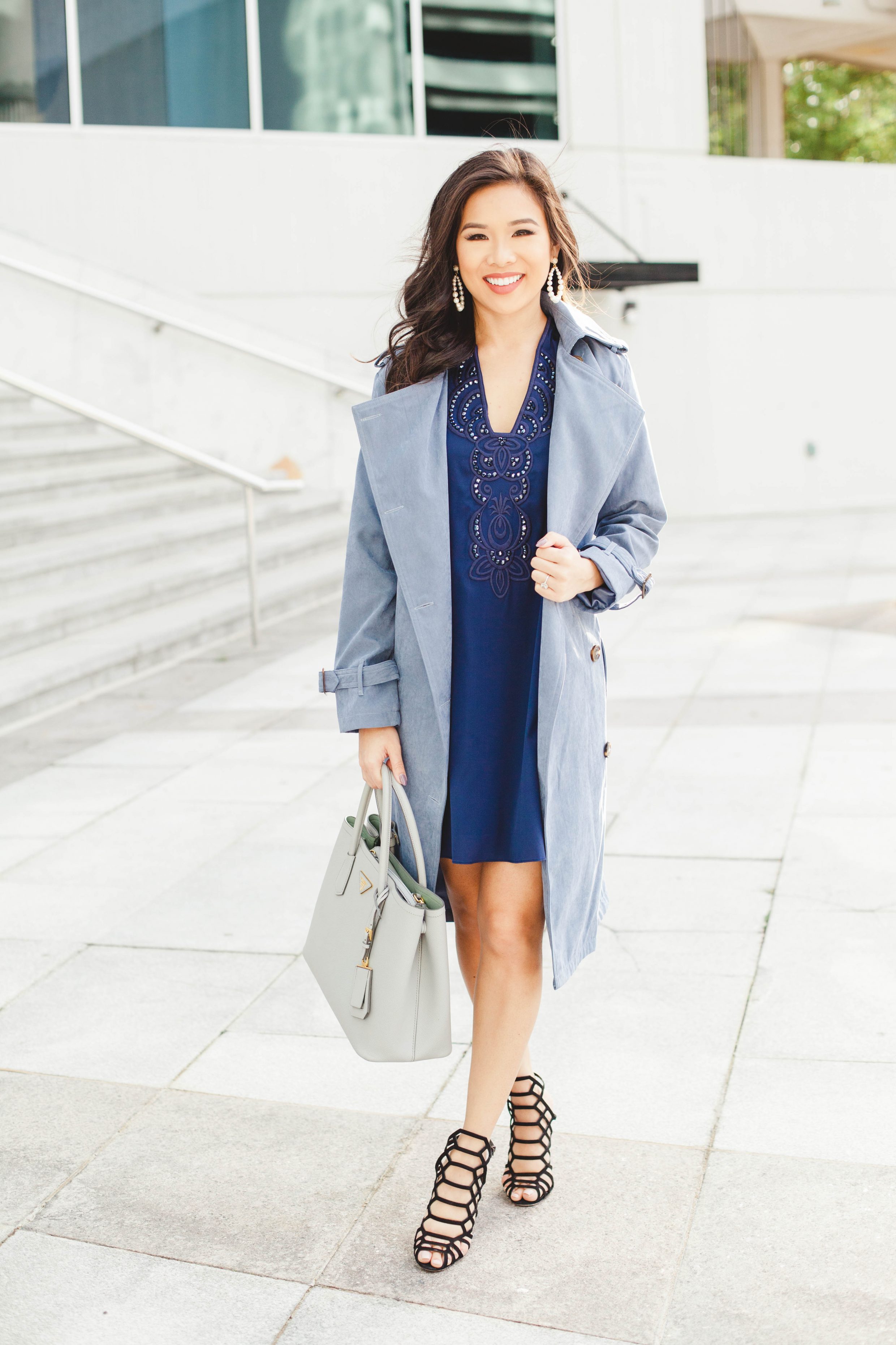 Navy blue silk tunic dress with dusty blue trench coat and cage heels