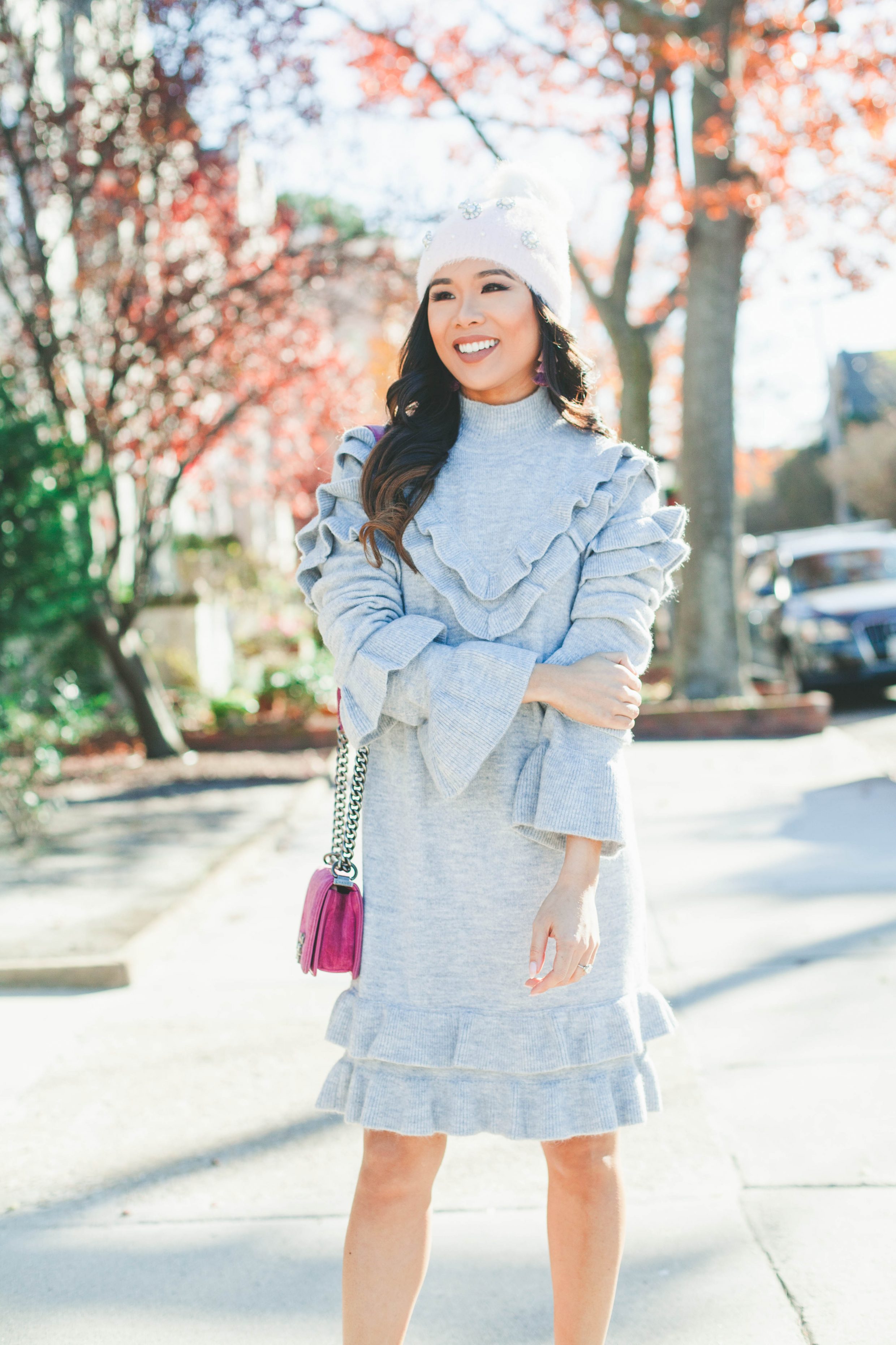 Gray ruffle sweater dress with velvet bow back heels and Chanel bag