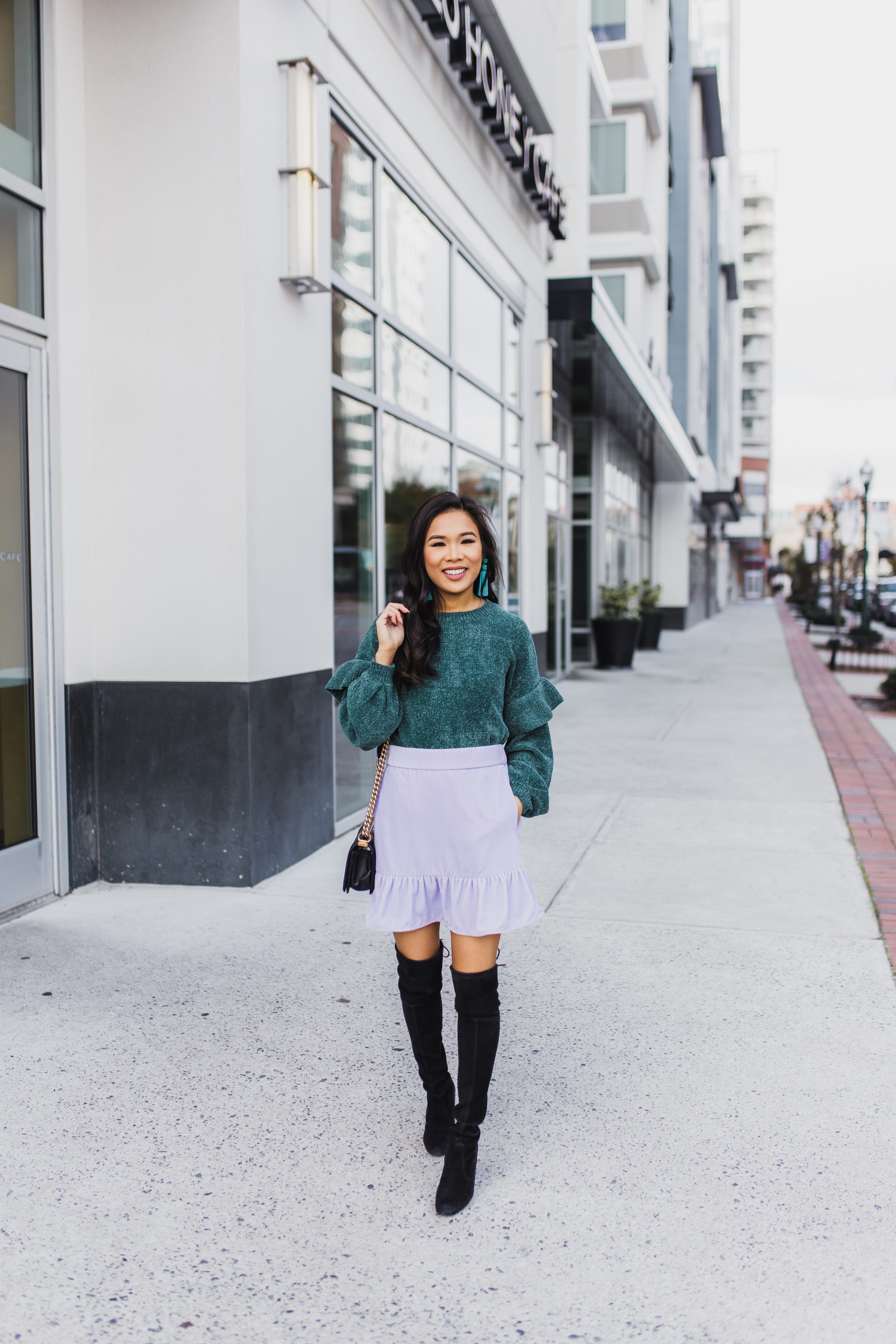 Chenille sweater with ruffle detail paired with velvet skirt and over the knee boots