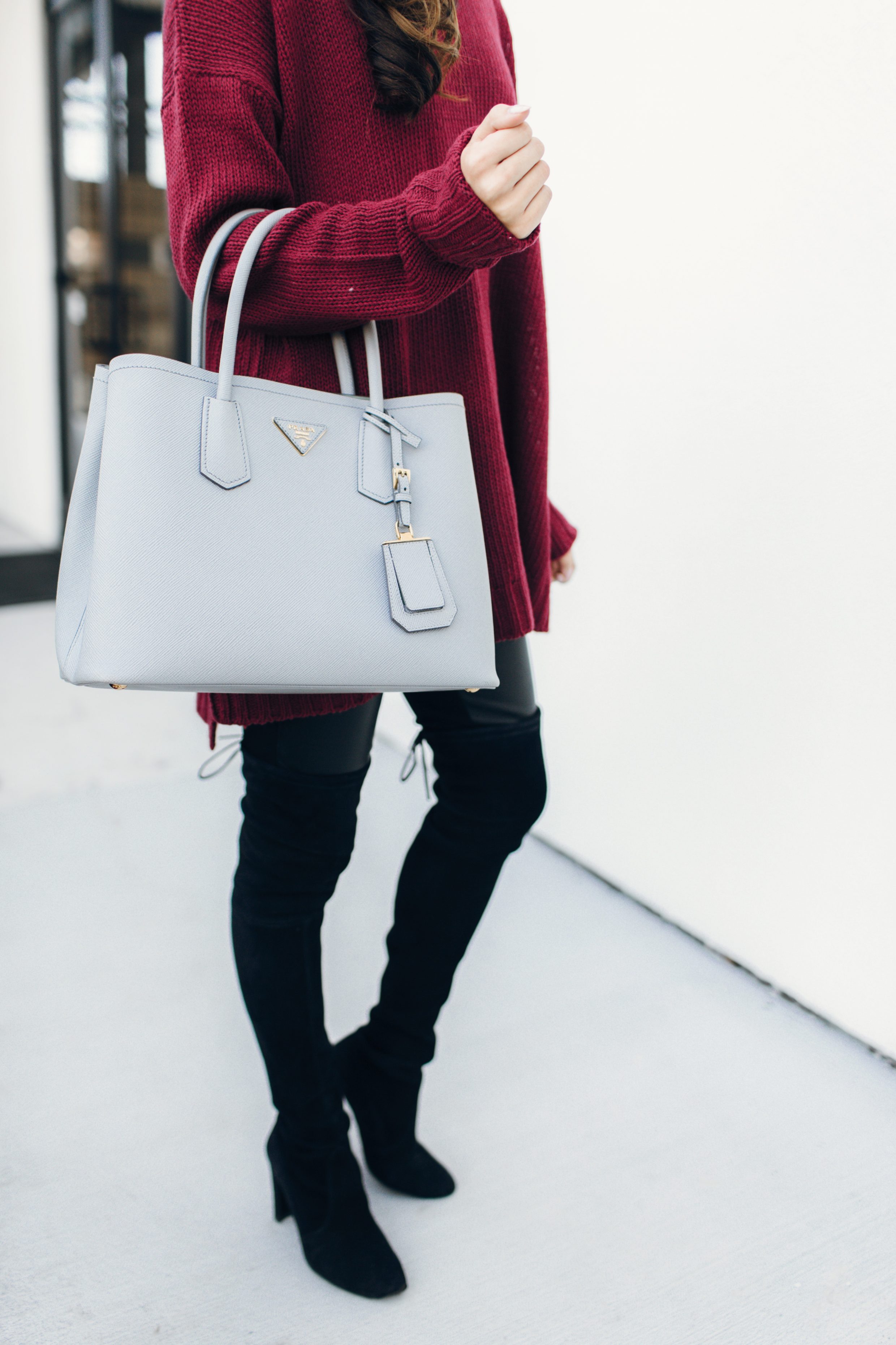 Maroon sweater with leather leggings and suede over the knee boots