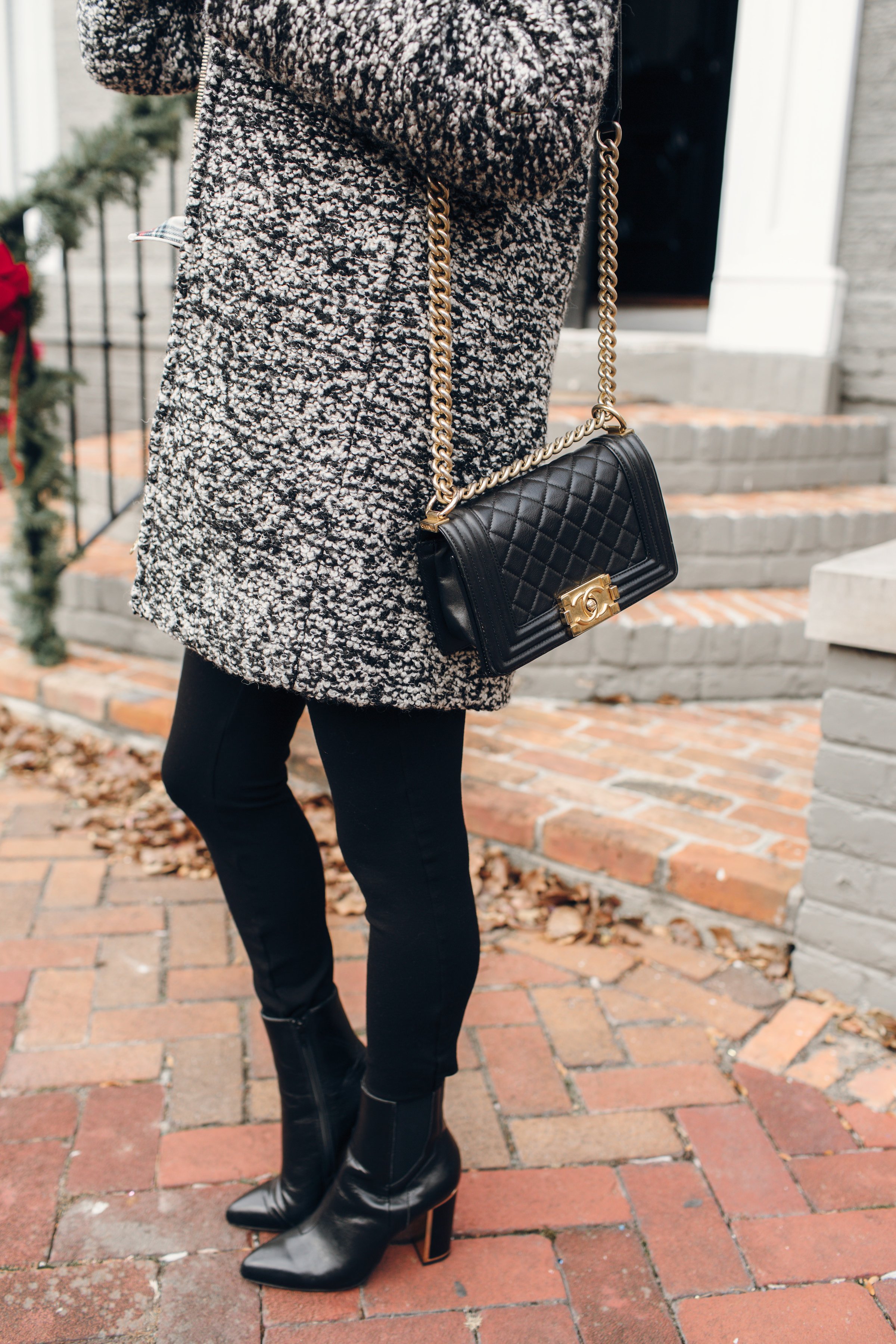 Speckled boucle wool coat with black pants and Chanel boy bag