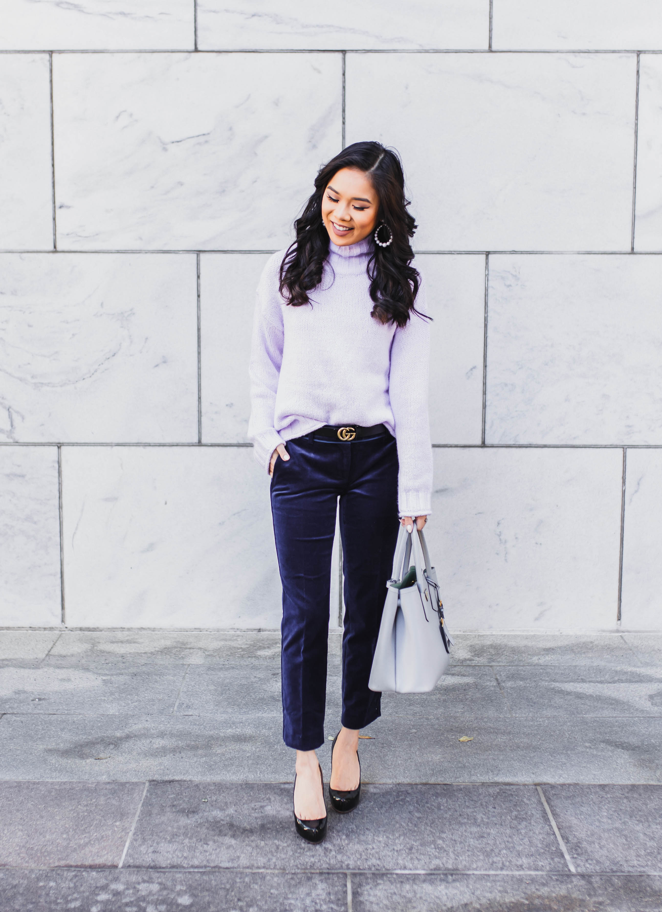 Winter workwear with a lavender sweater and navy velvet pants