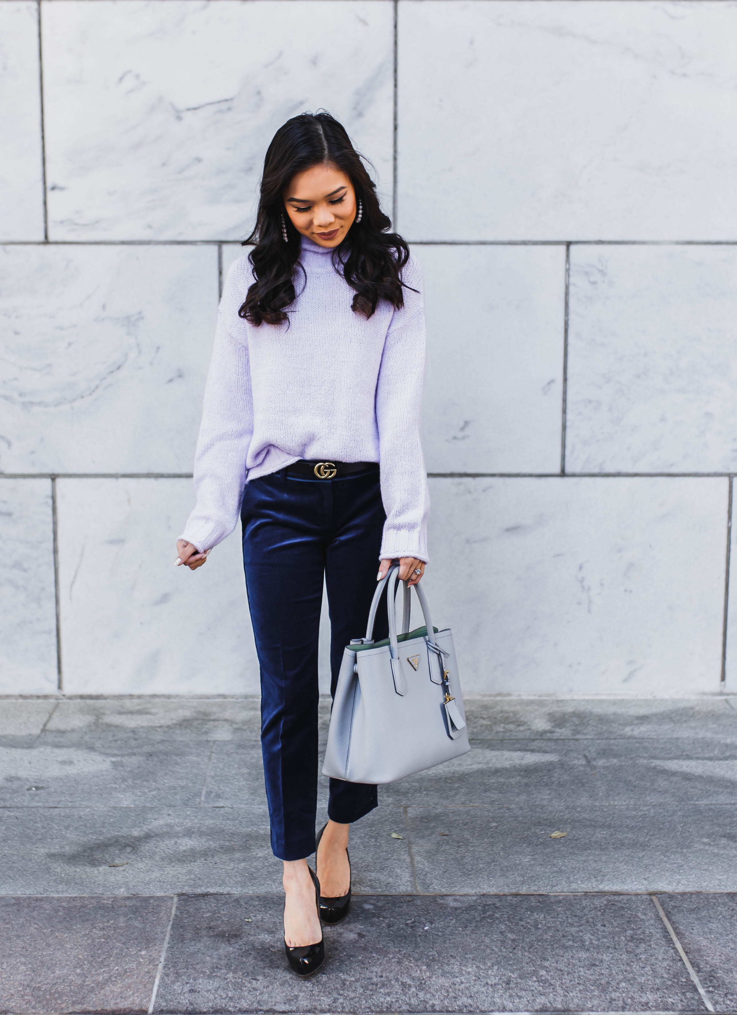Winter workwear with a lavender sweater and navy velvet pants