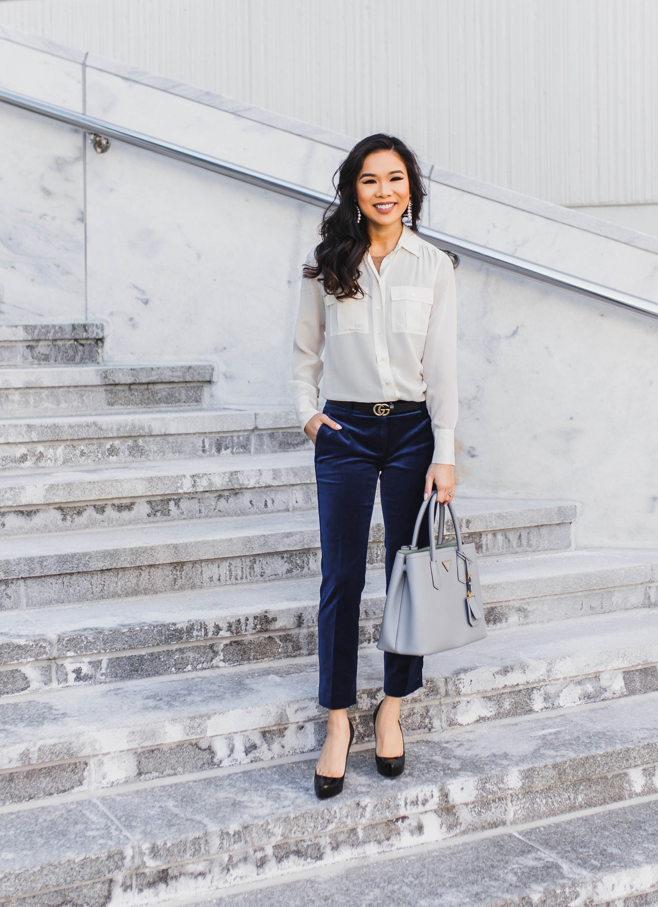 White blouse with navy blue velvet pants for work