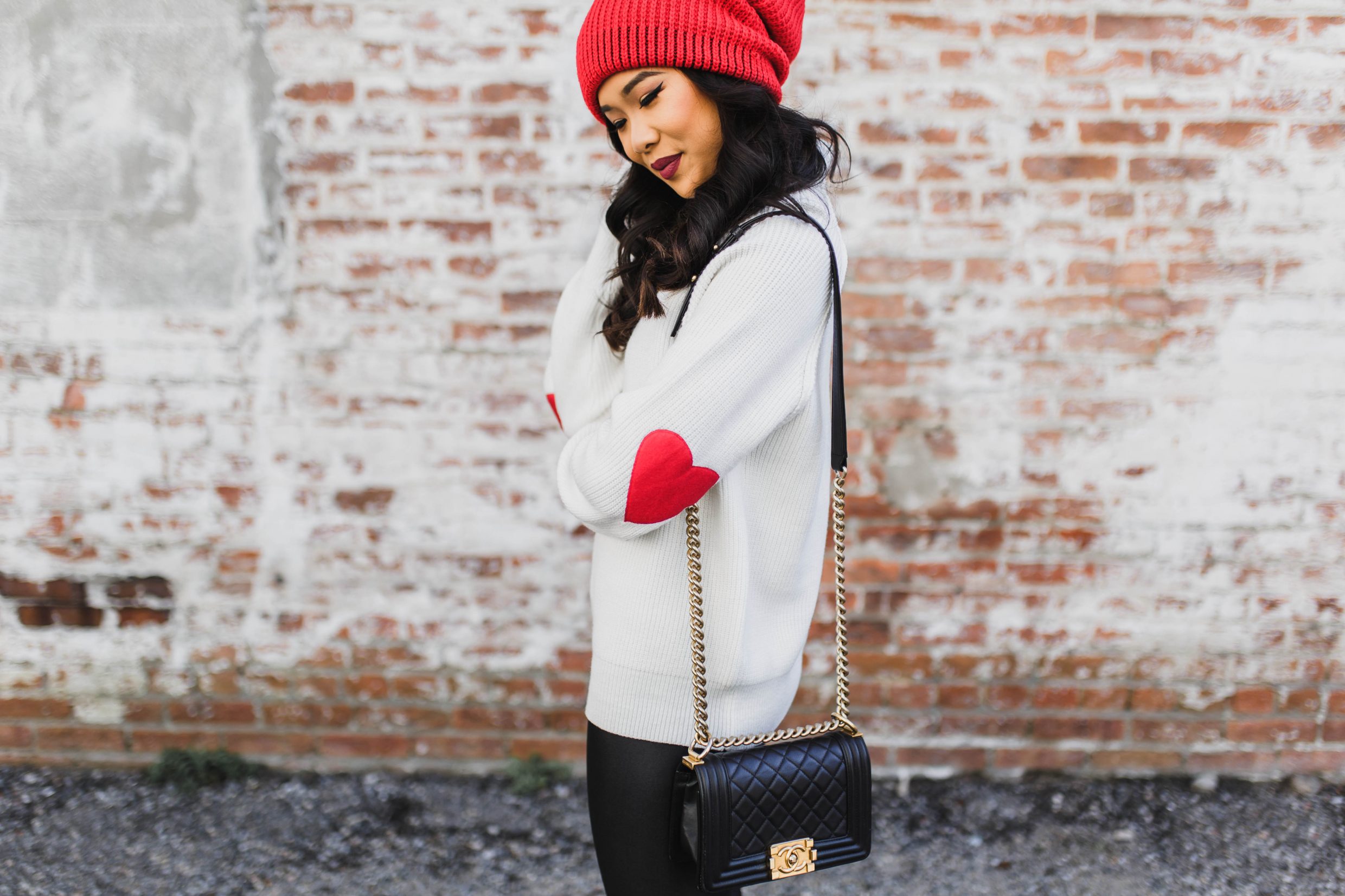 Heart Patch Sweater with black leggings and conquest winter boots