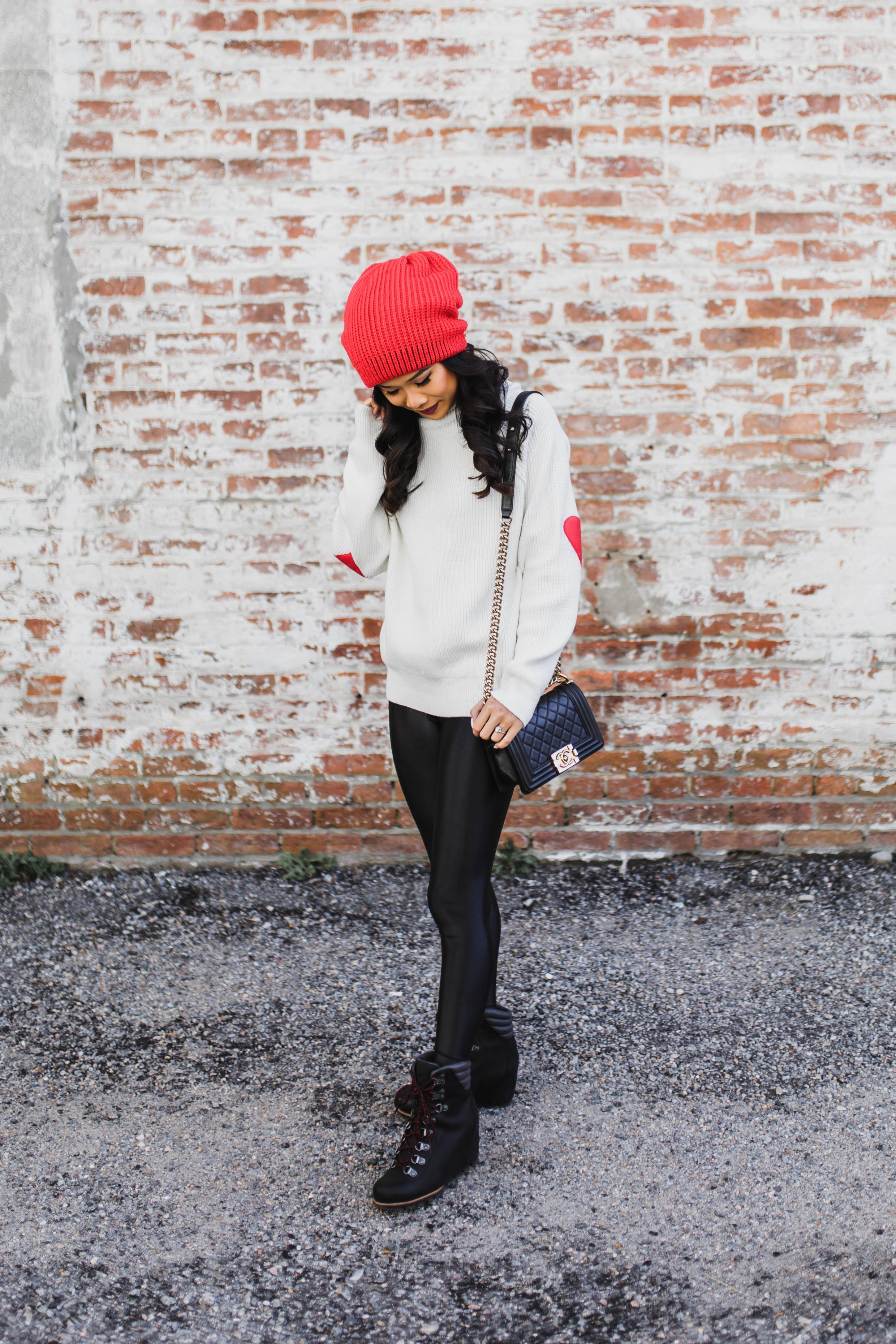 Heart Patch Sweater with black leggings and conquest winter boots