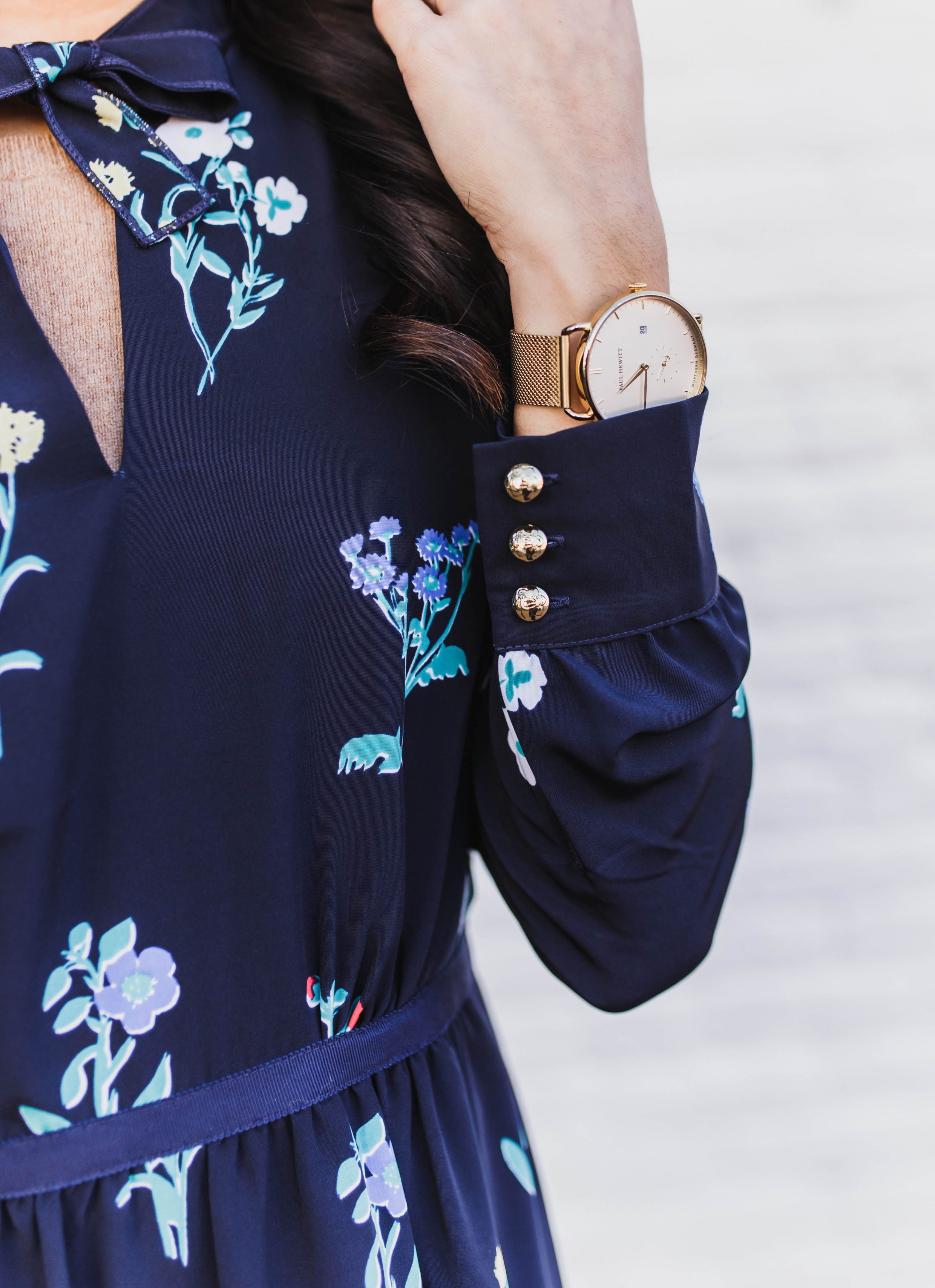 Blogger Hoang-Kim wears the Tisdale floral dress for Spring with a gold Paul Hewitt watch