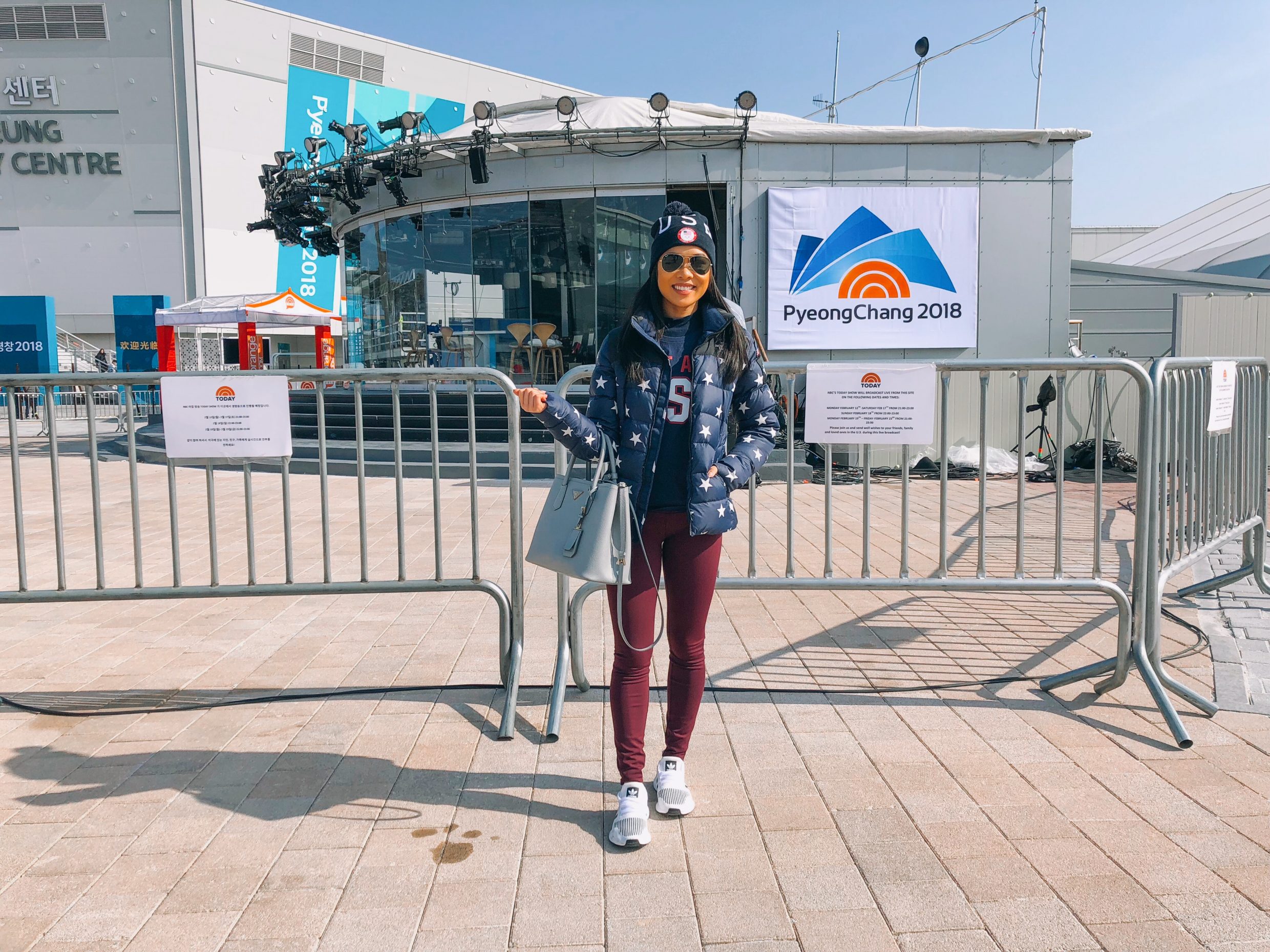 The North Face Star Print Jacket with burgundy leggings and Team USA Nike hat outside Today Show Set at PyeongChang 2018 Winter Olympics
