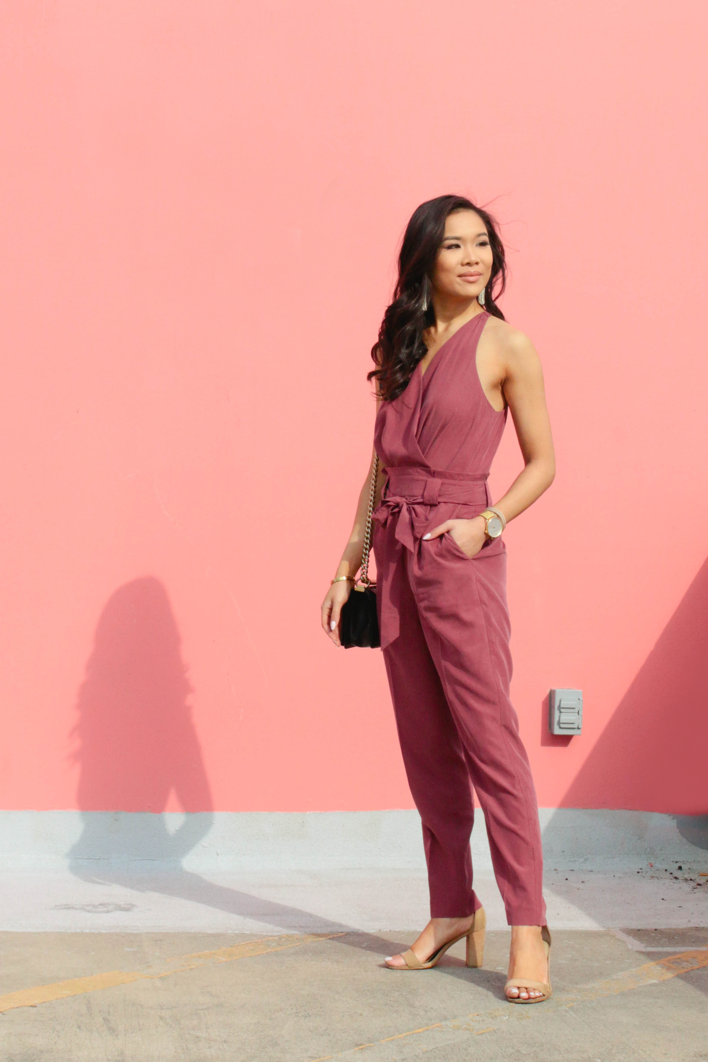 Mauve surplice jumpsuit with white tassel earrings for spring