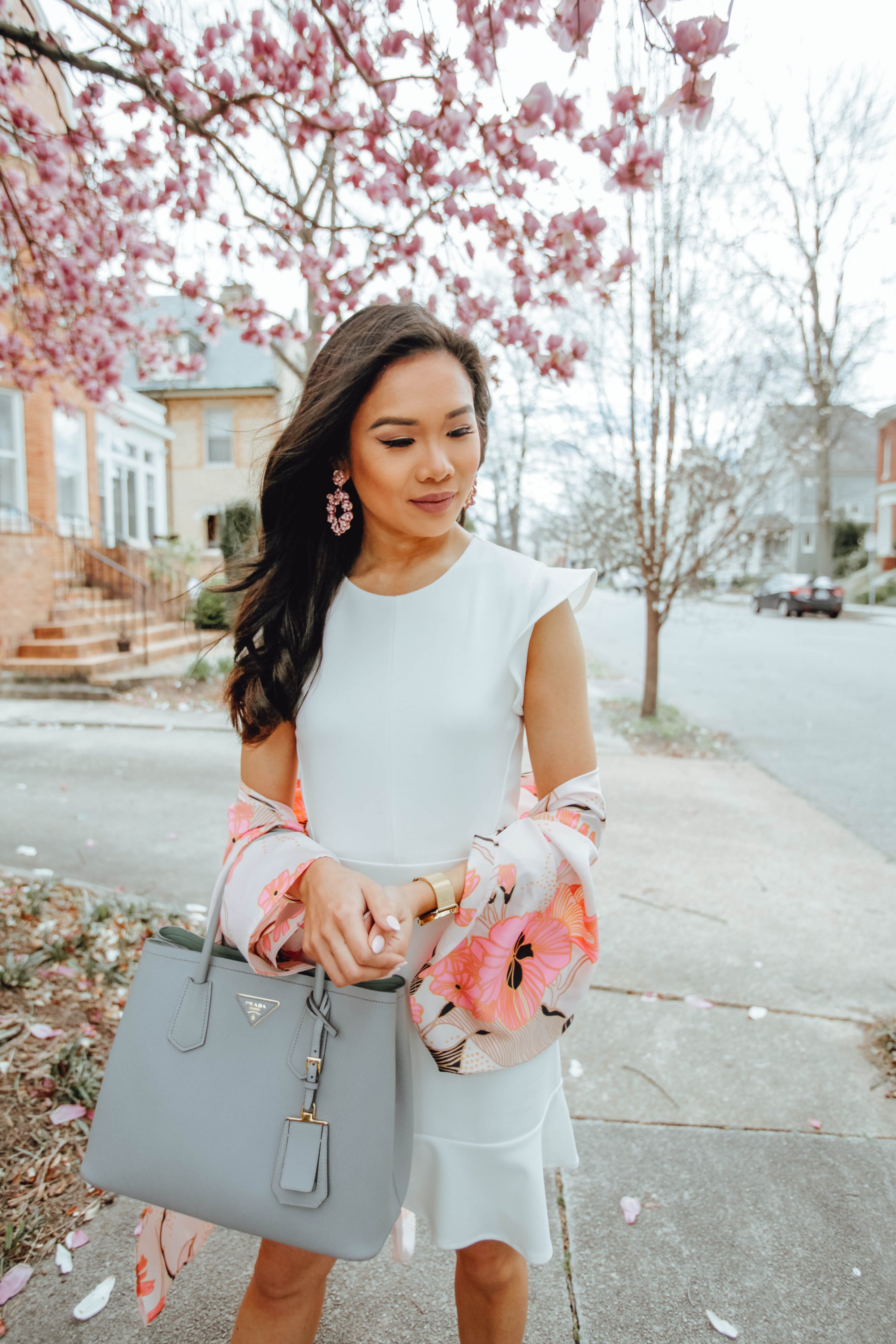 Blogger Hoang-Kim wears a white ruffle sleeve dress and floral kimono