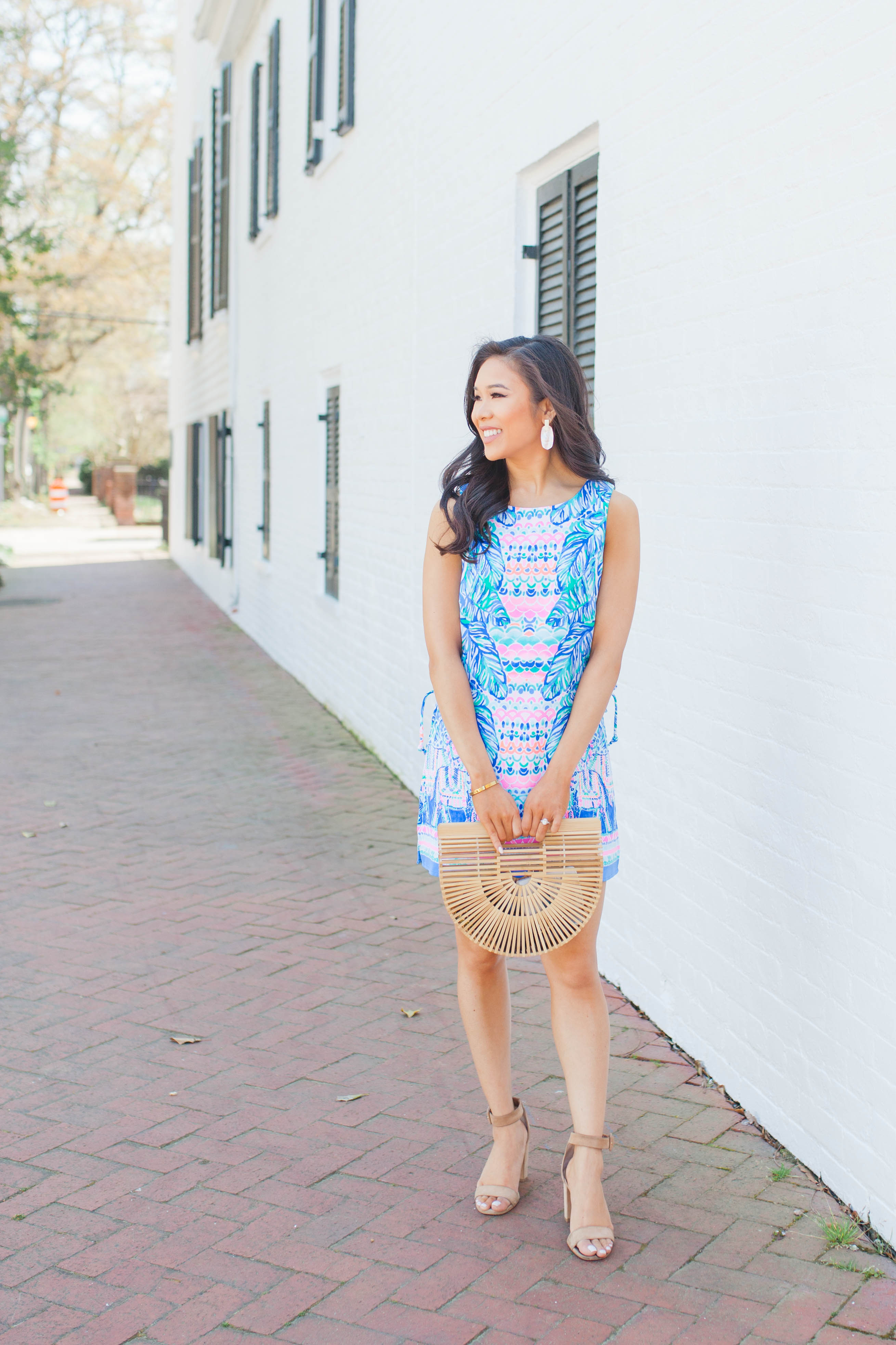 Lilly Pulitzer Donna Romper with Cult Gaia bamboo bag and Kendra Scott earrings on blogger Hoang-Kim
