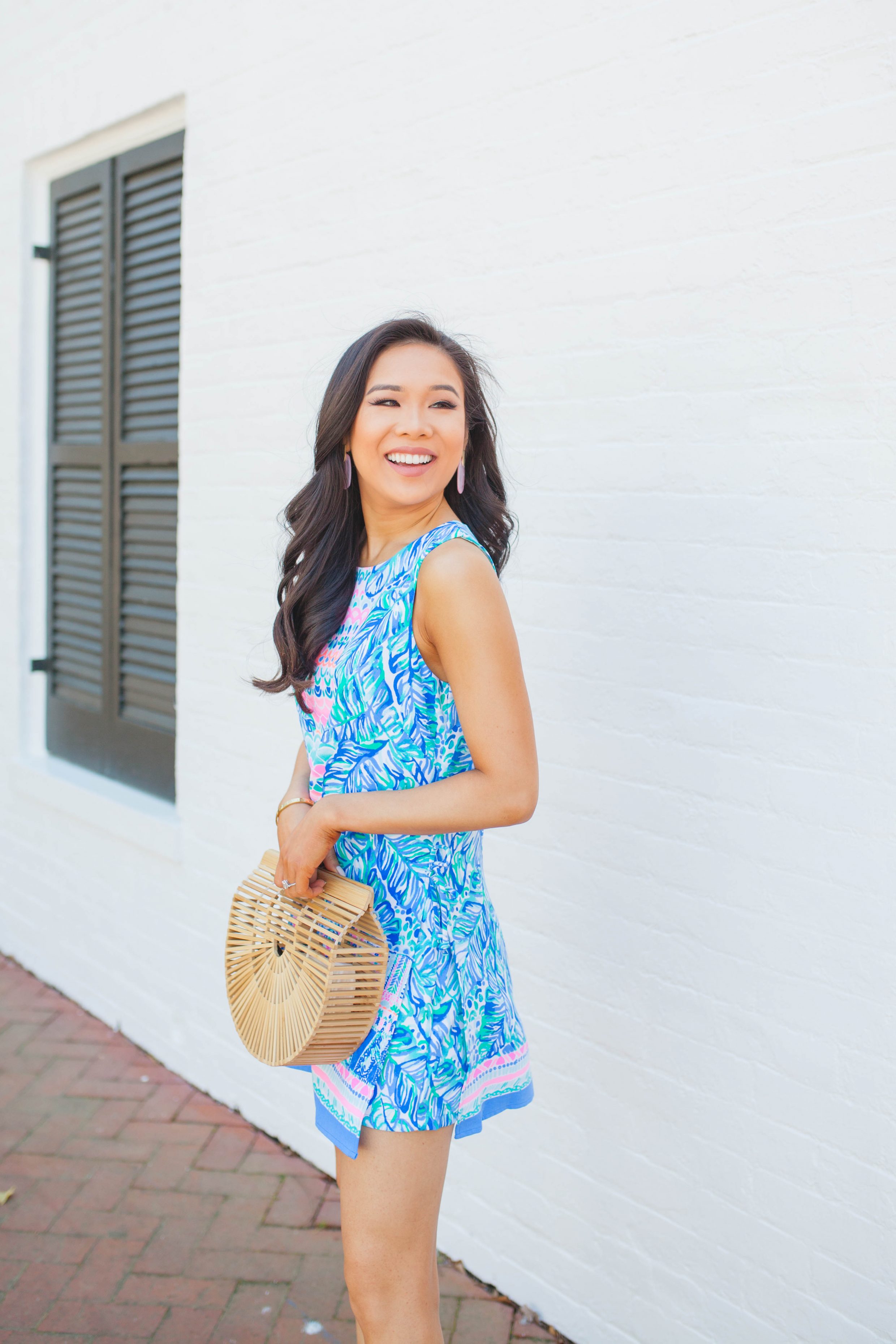 Lilly Pulitzer Donna Romper with Cult Gaia bamboo bag and Kendra Scott earrings on blogger Hoang-Kim