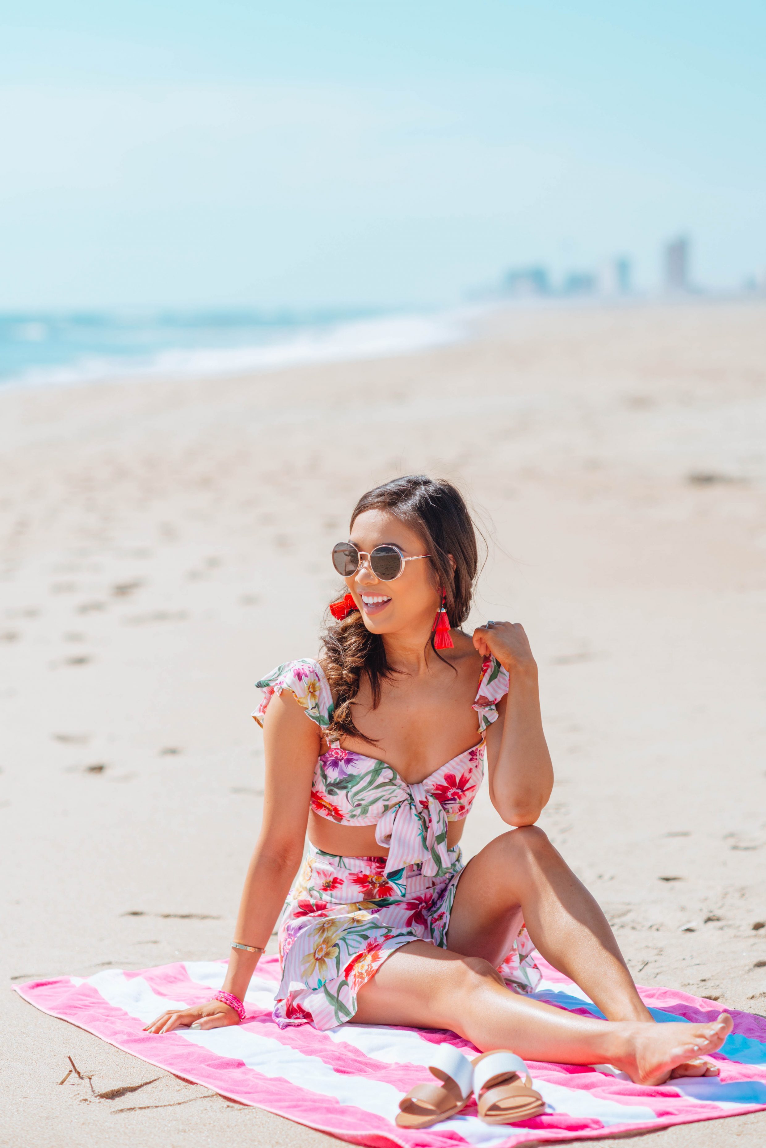 Floral two piece set with tassel earrings and a fishtail braid for the beach