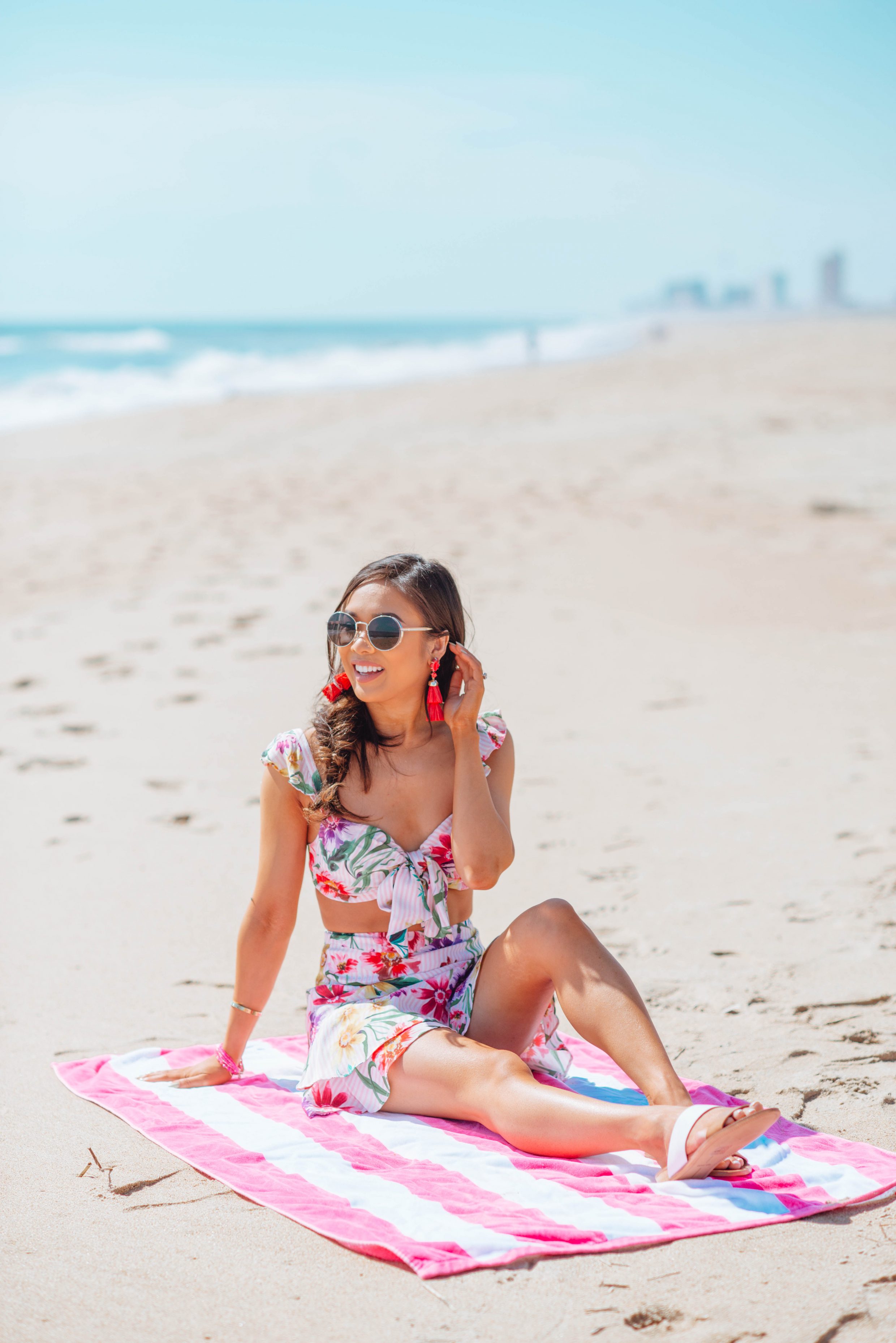 Floral two piece set with tassel earrings and a fishtail braid for the beach