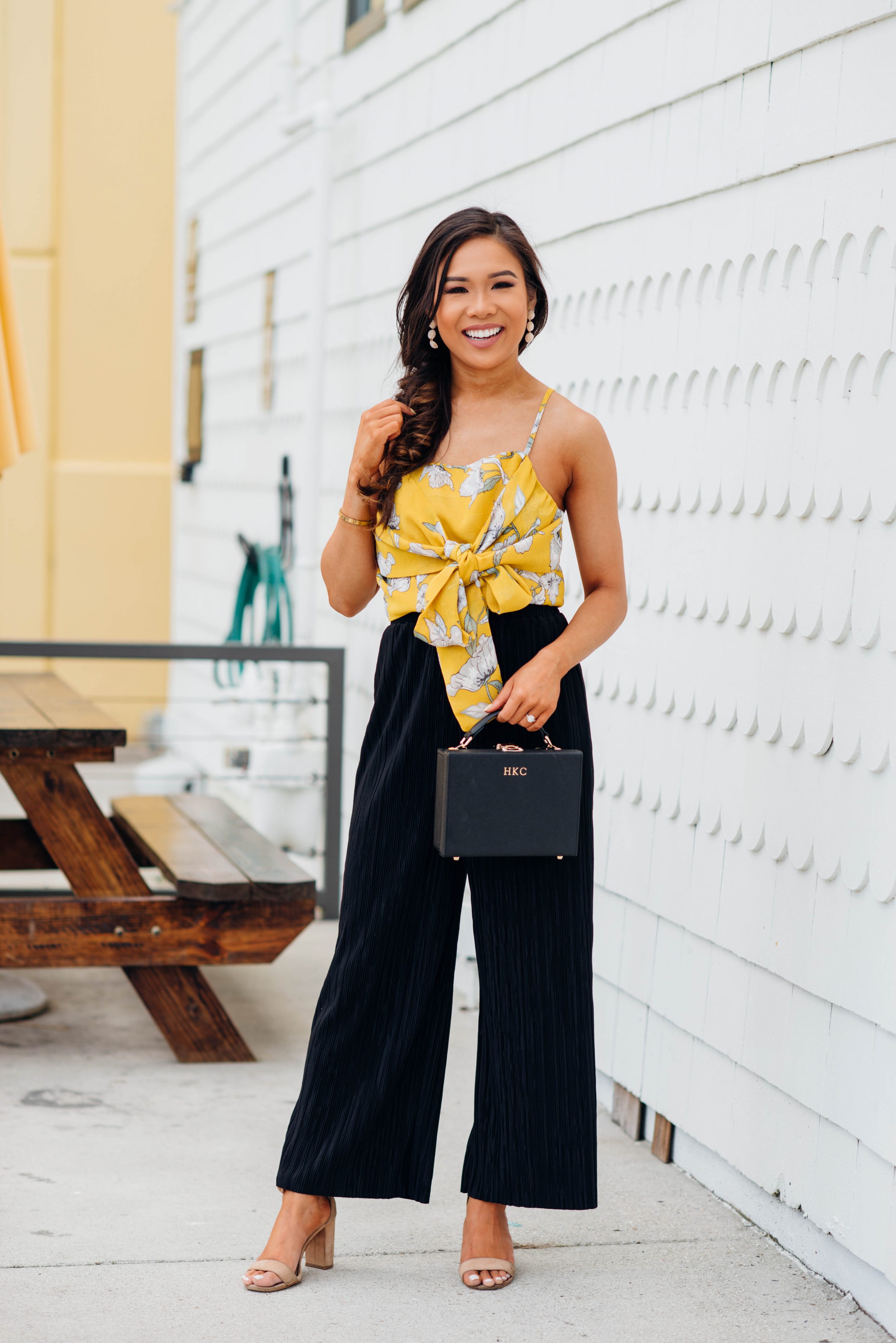 Hoang-Kim styles a crop top with black wide-leg pants and fishtail braid
