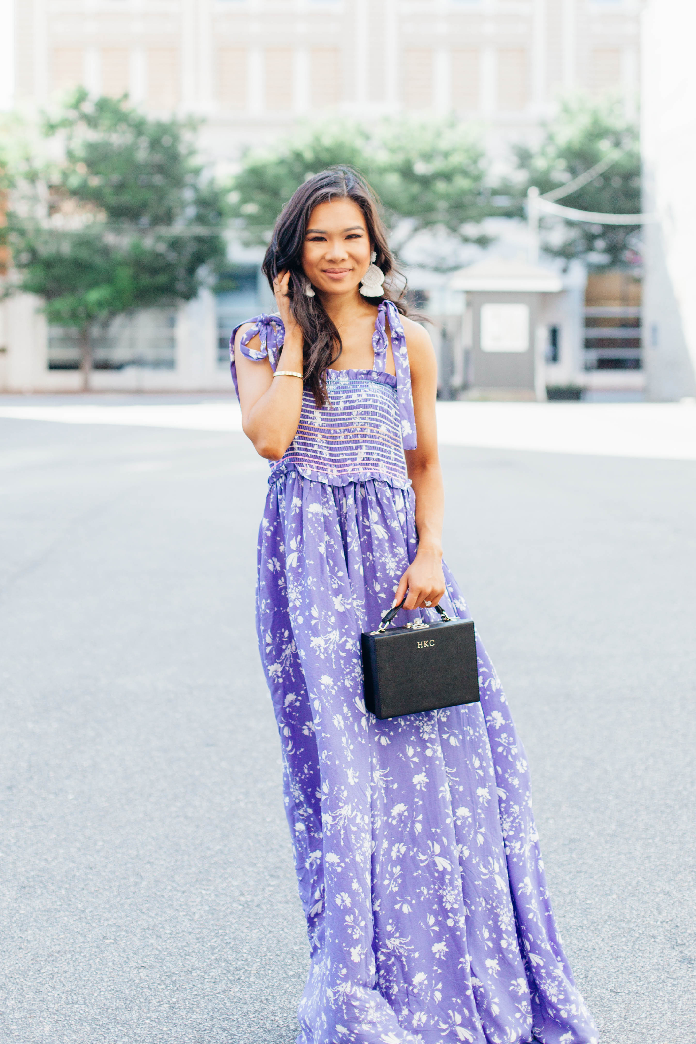 Purple wide leg floral jumpsuit and white beaded earrings