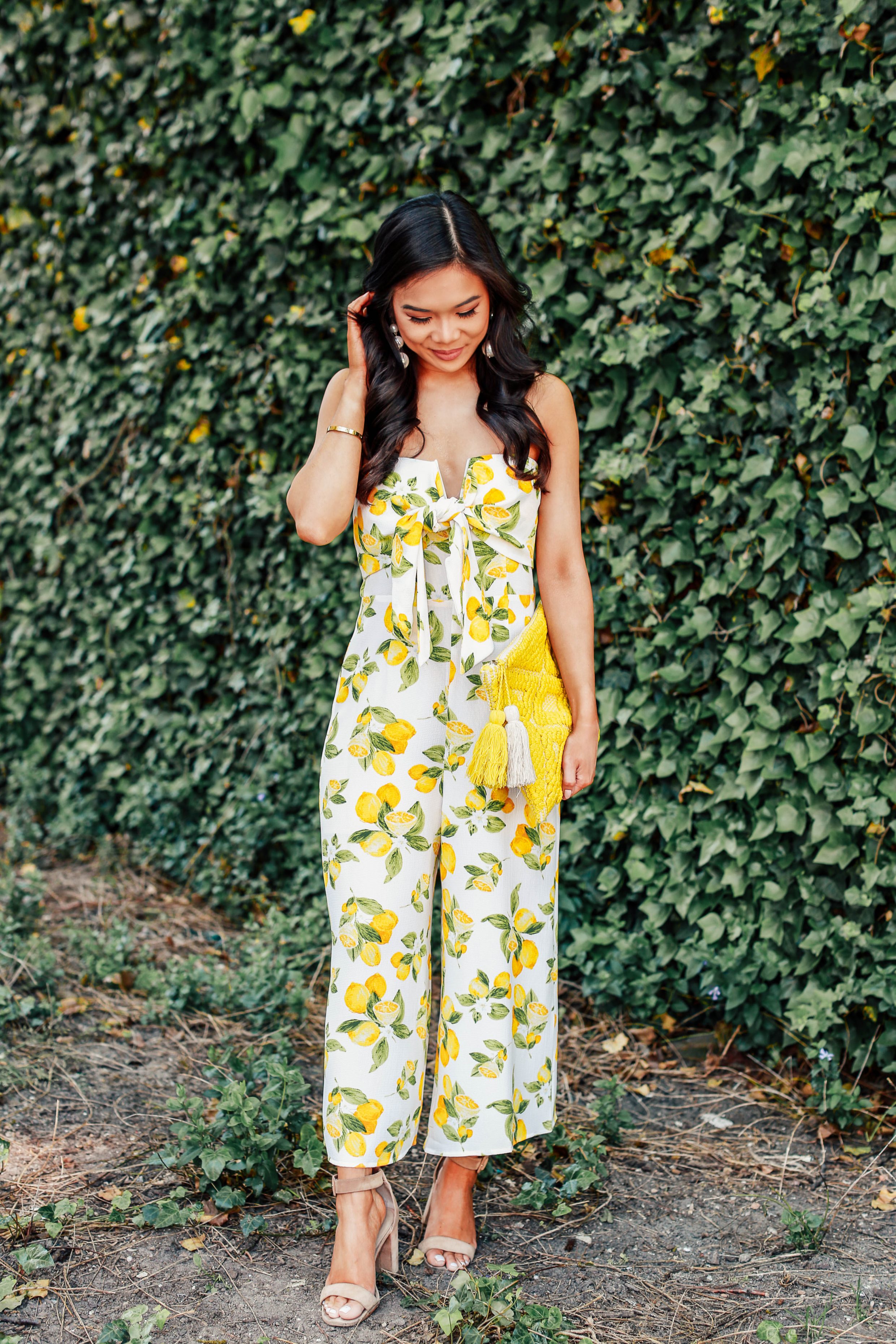 Hoang-Kim wears a strapless lemon print jumpsuit perfect for summer