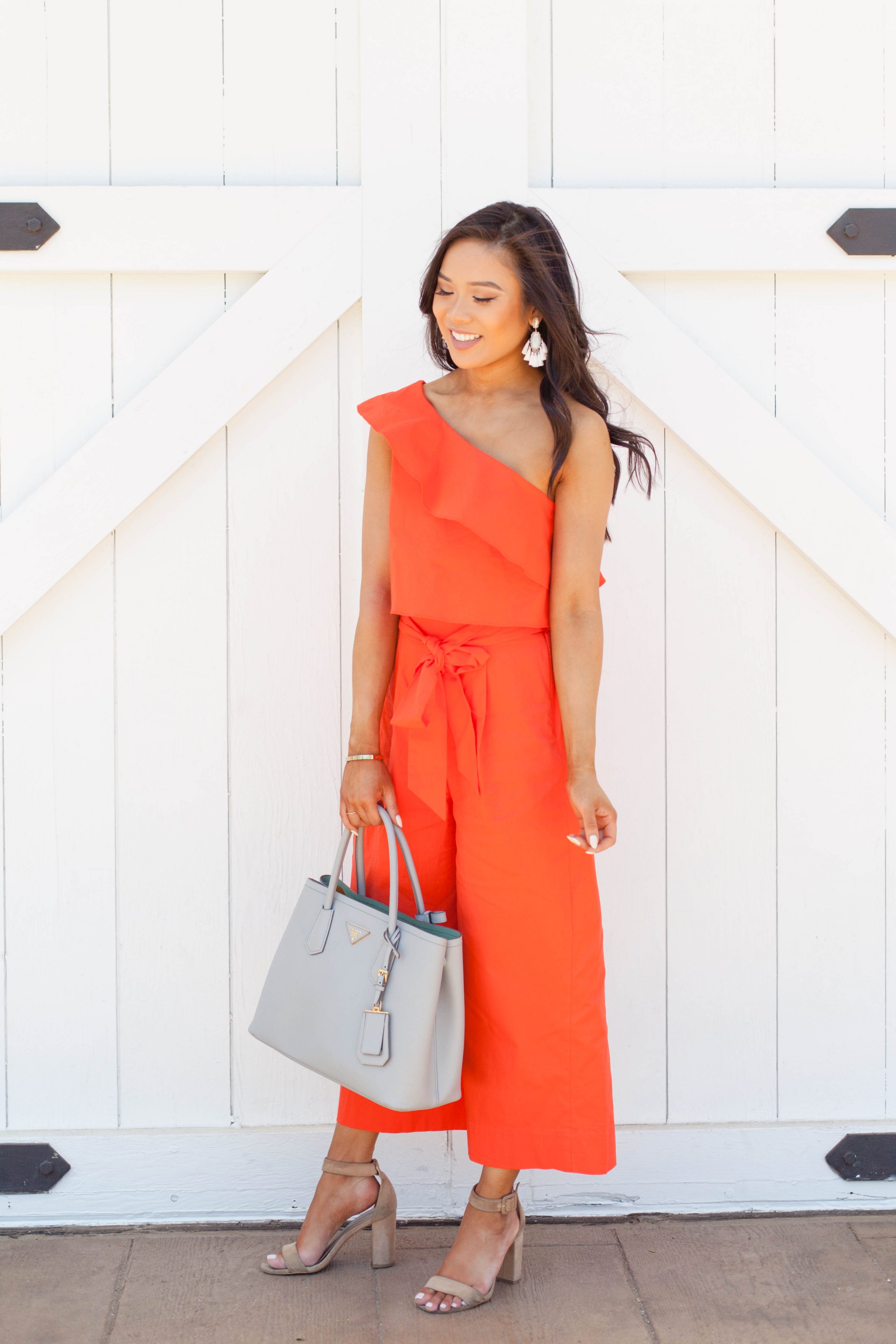 Summer outfit idea orange one-shouldered jumpsuit less than $100