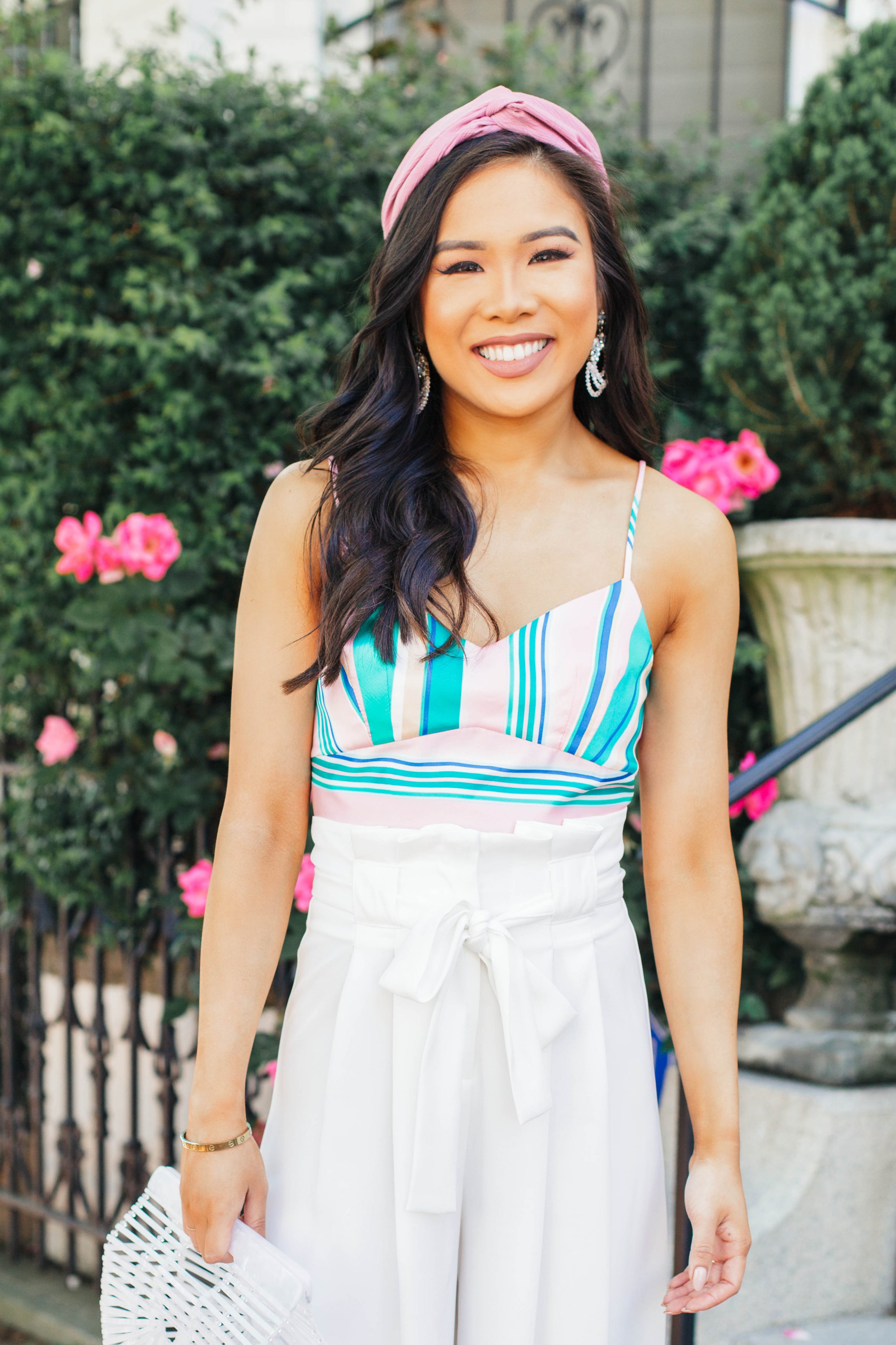 Blogger Hoang-Kim wears a striped crop top with white wide leg pants
