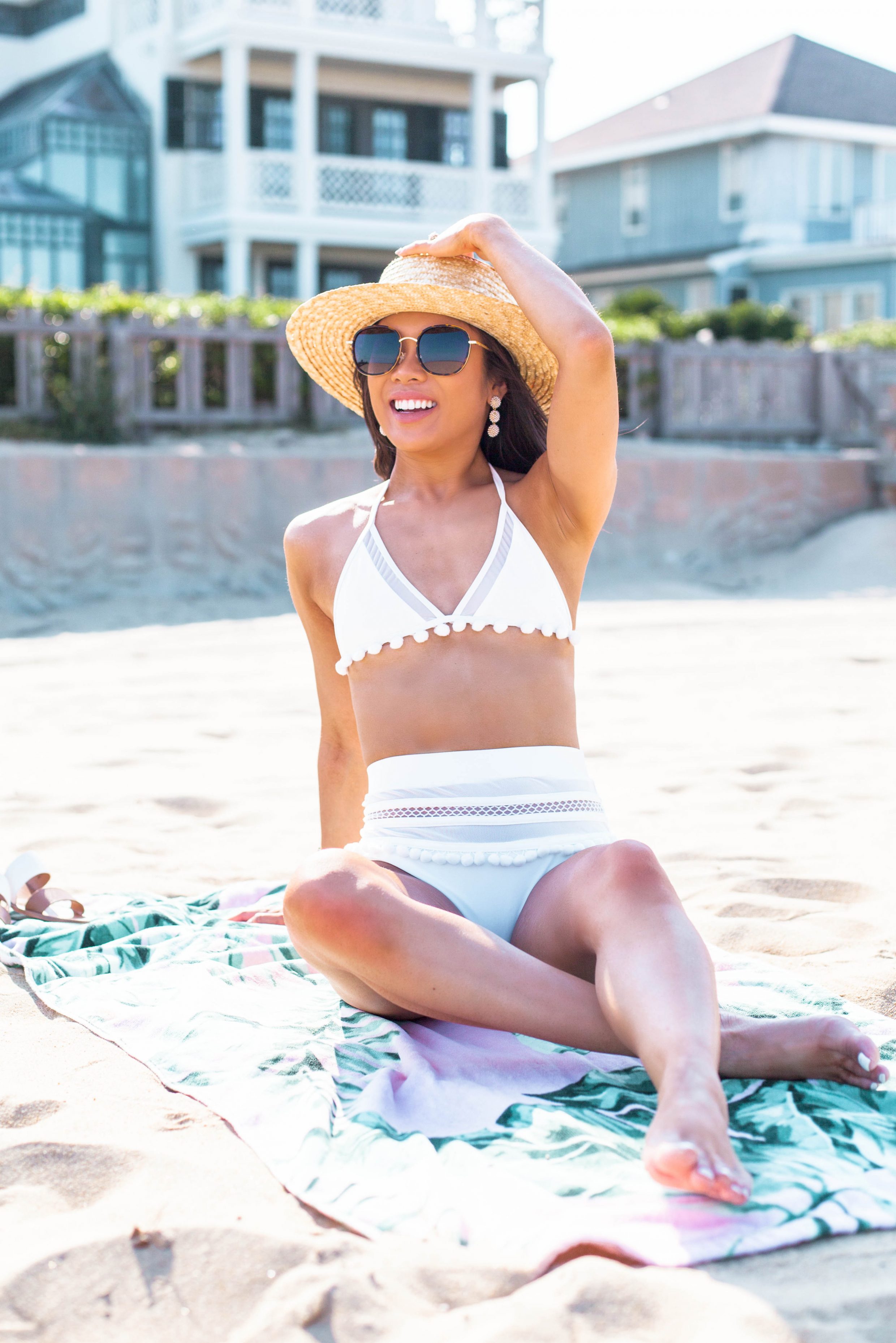 Hoang-Kim wears a white pom pom high-waisted bikini for summer