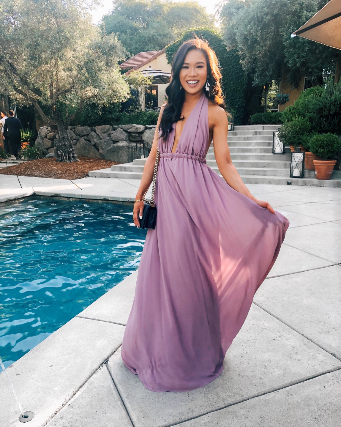 Mauve halter dress with white tassel earrings for wedding guest style