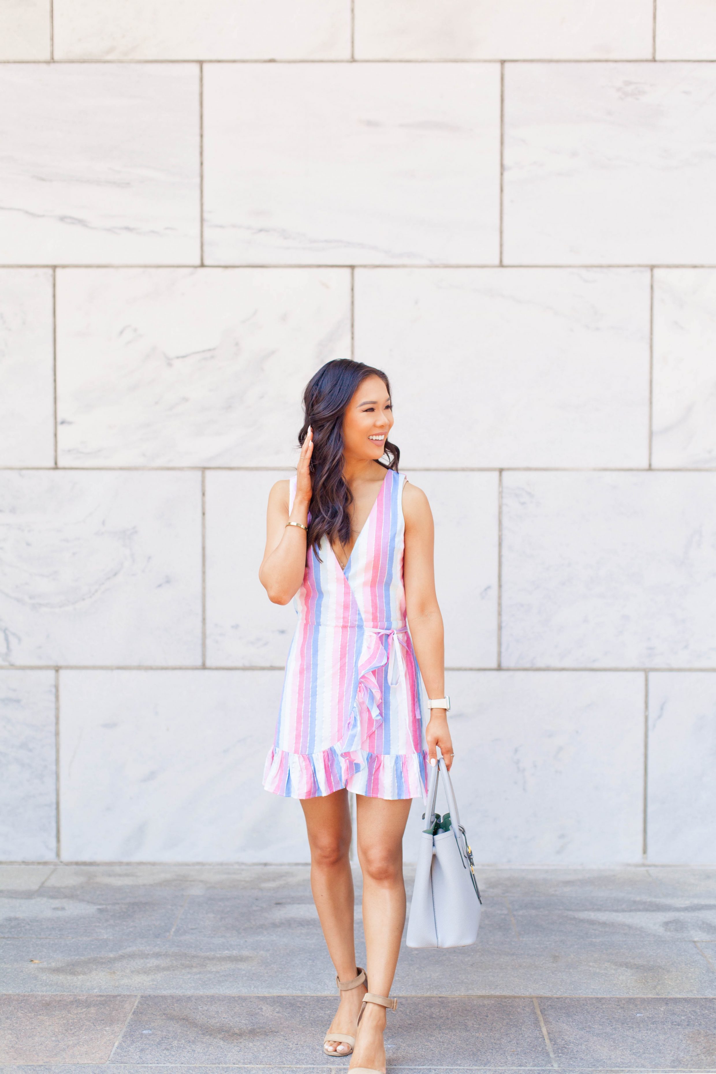Pastel striped dress for summer with ruffle hem and suede heels