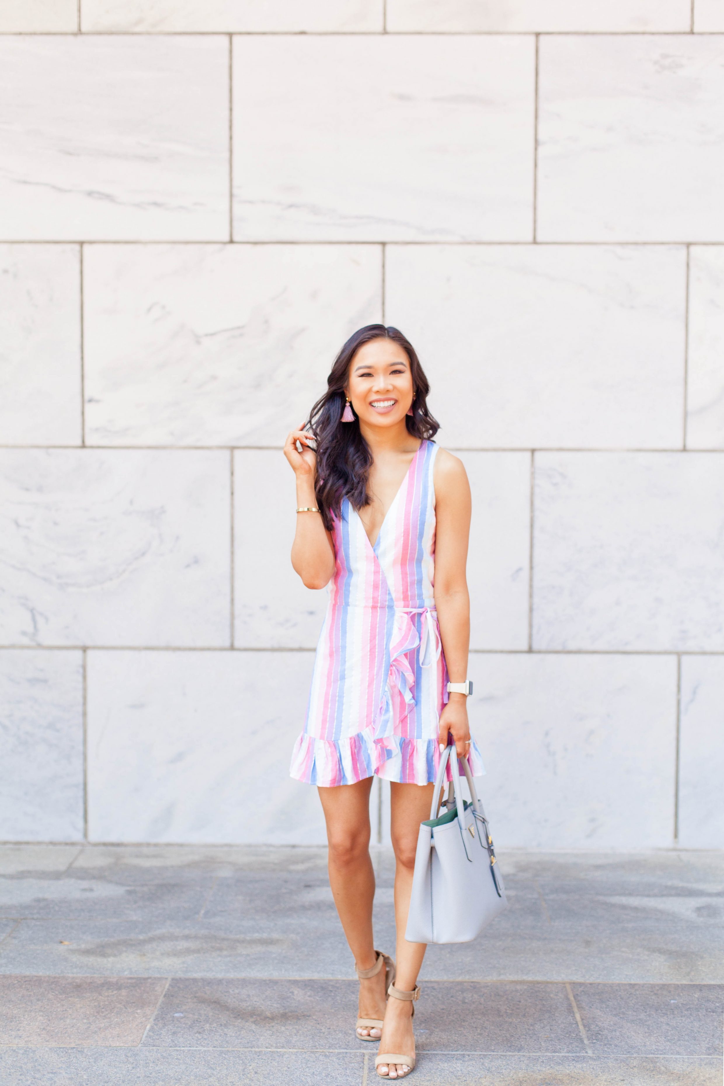 Hoang-Kim wears a pastel striped dress for summer
