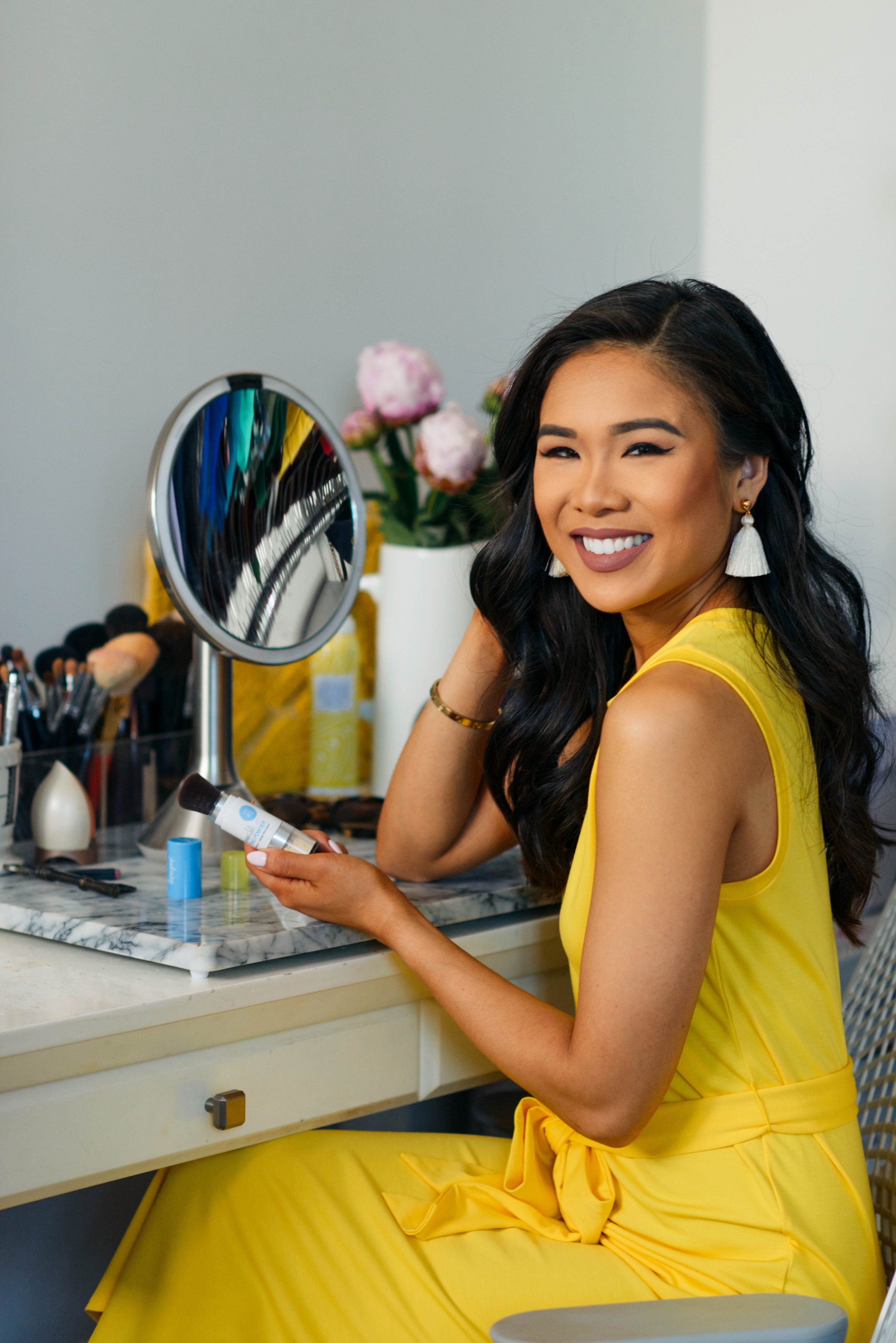 Hoang-Kim using Supergoop! Unseen Sunscreen with SPF 40