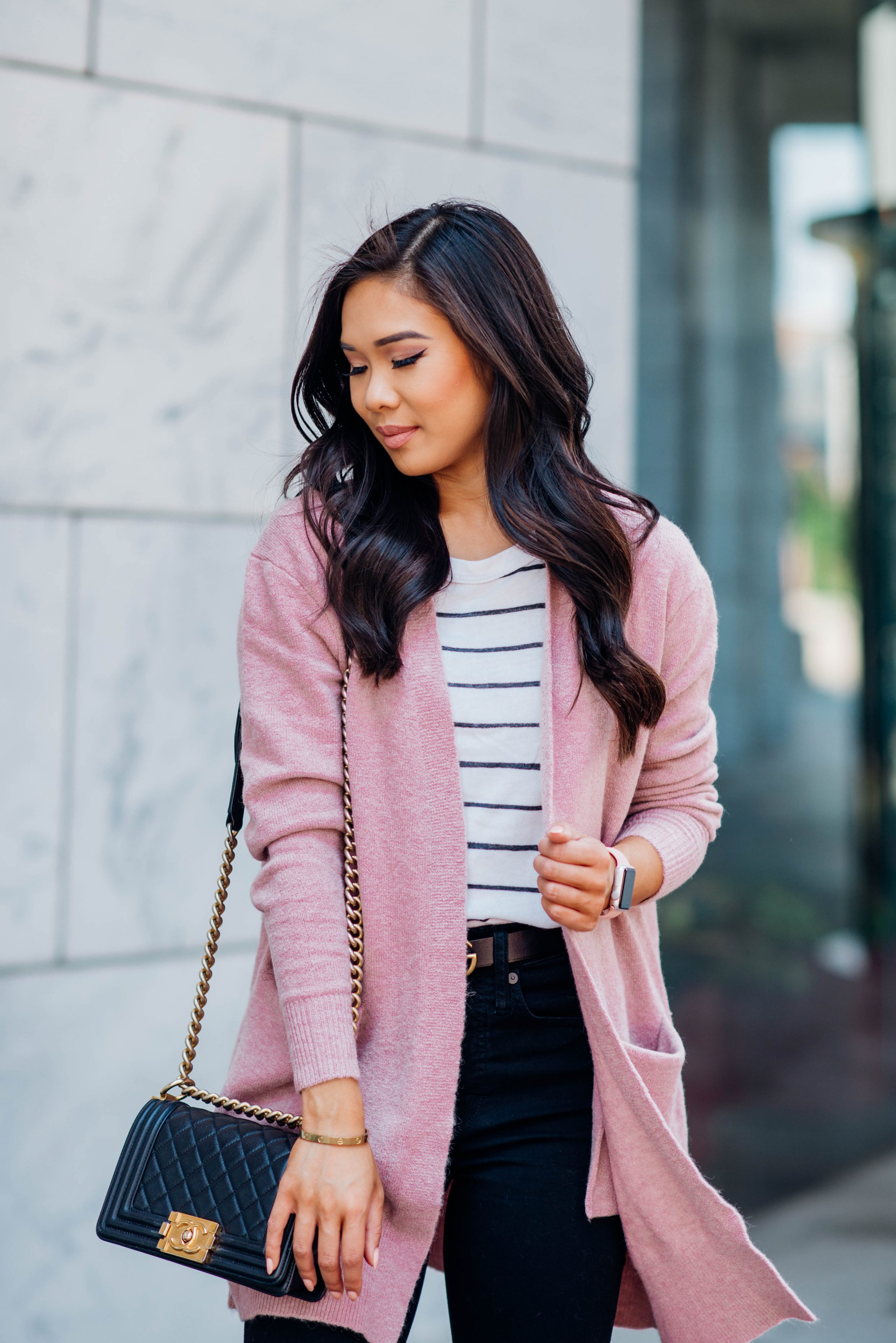 Easy fall look with a striped tee, blush cardigan and black jeans