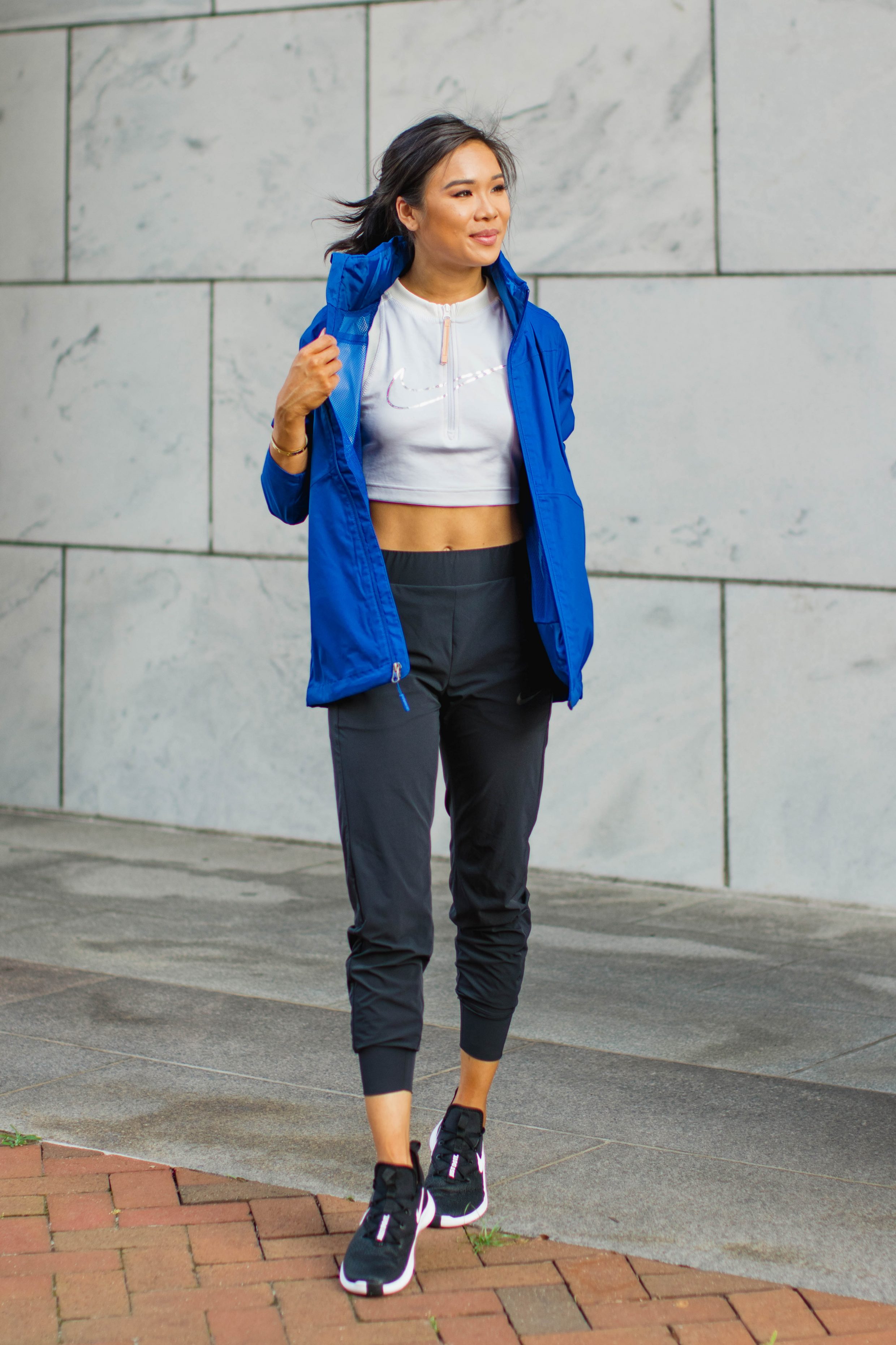 Athleisure style with black joggers, crop top and jacket