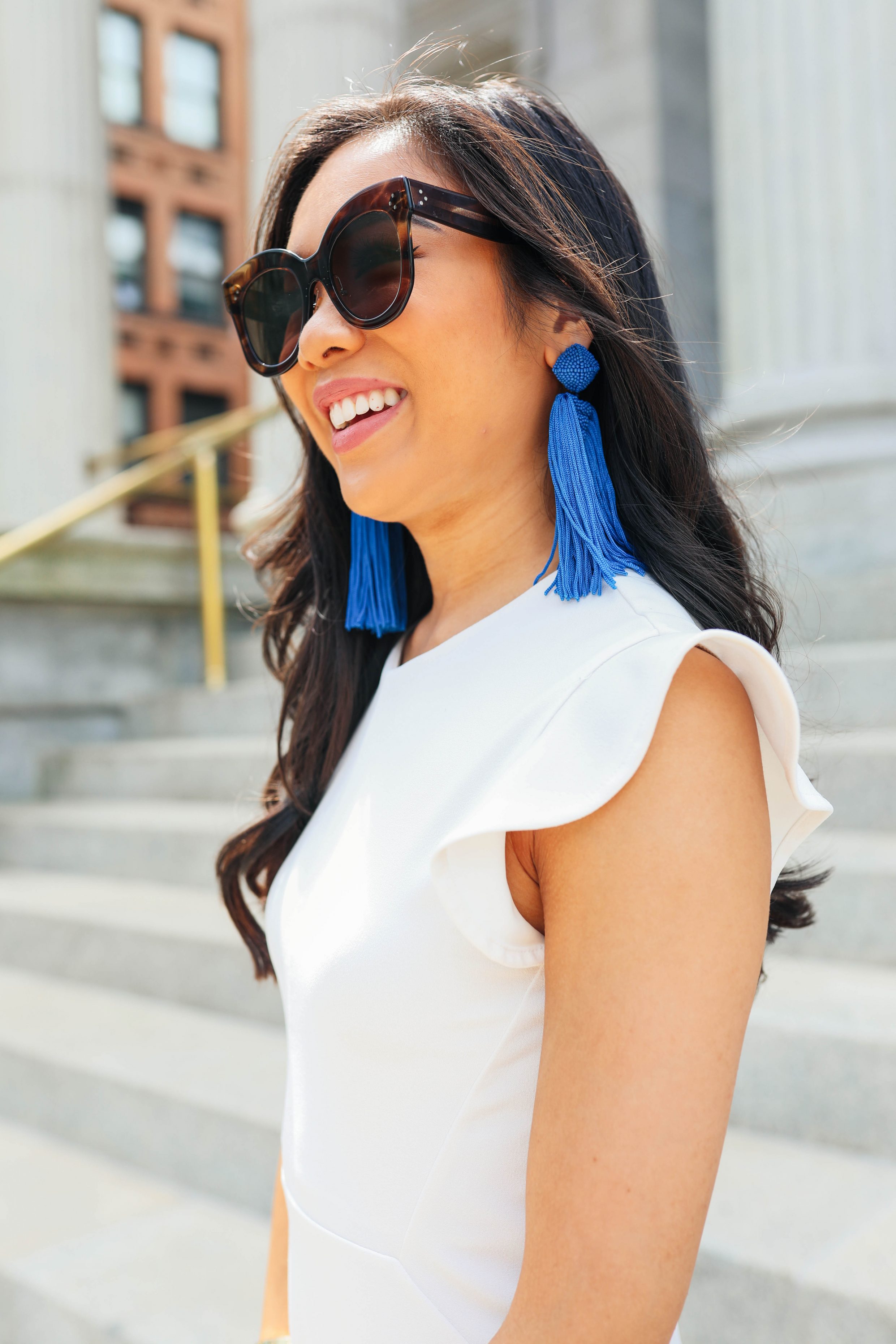 Hoang-Kim of Color & Chic wears Sachin & Babi blue tassel earrings 