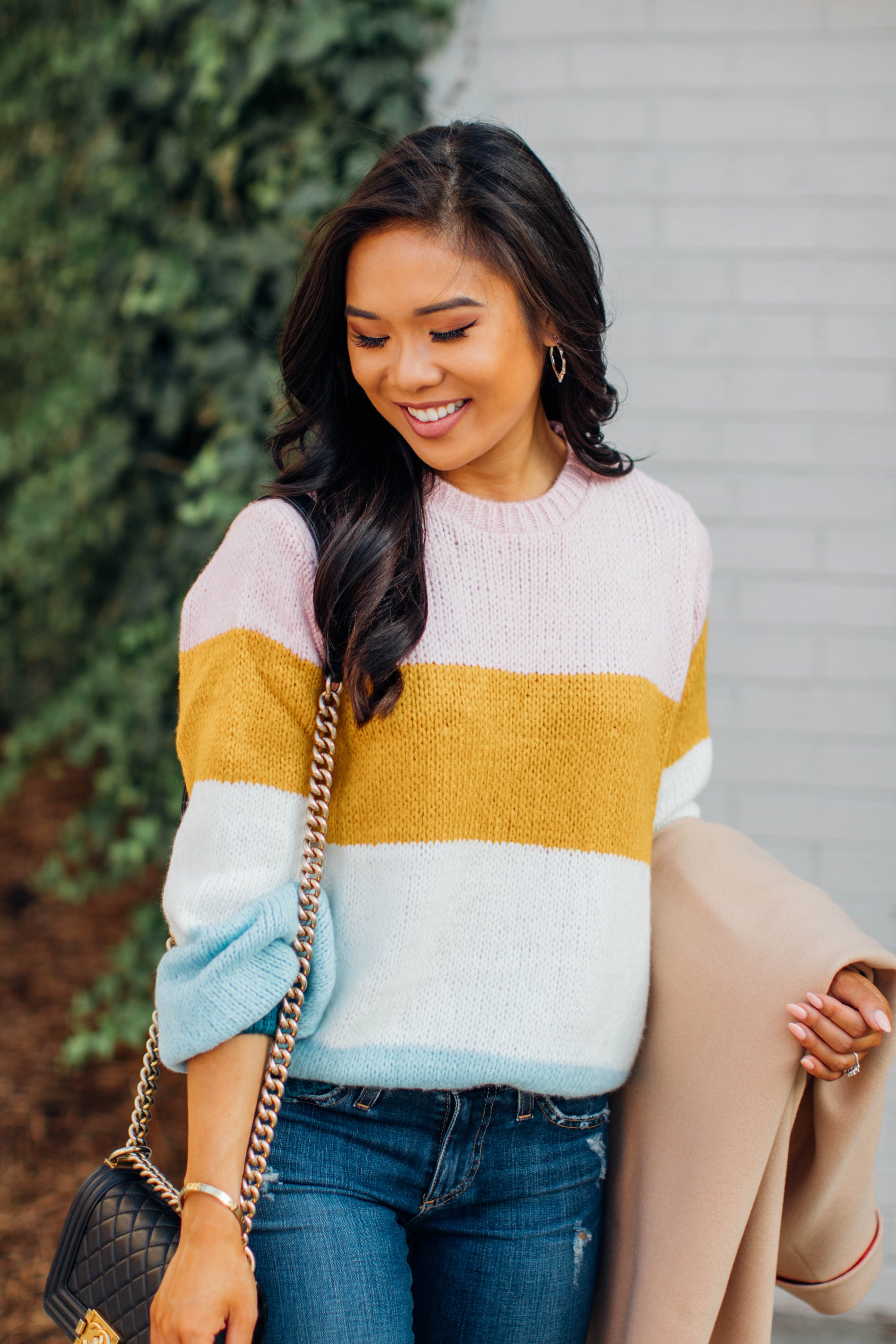 Blogger Hoang-Kim wears a Topshop striped transition sweater for fall