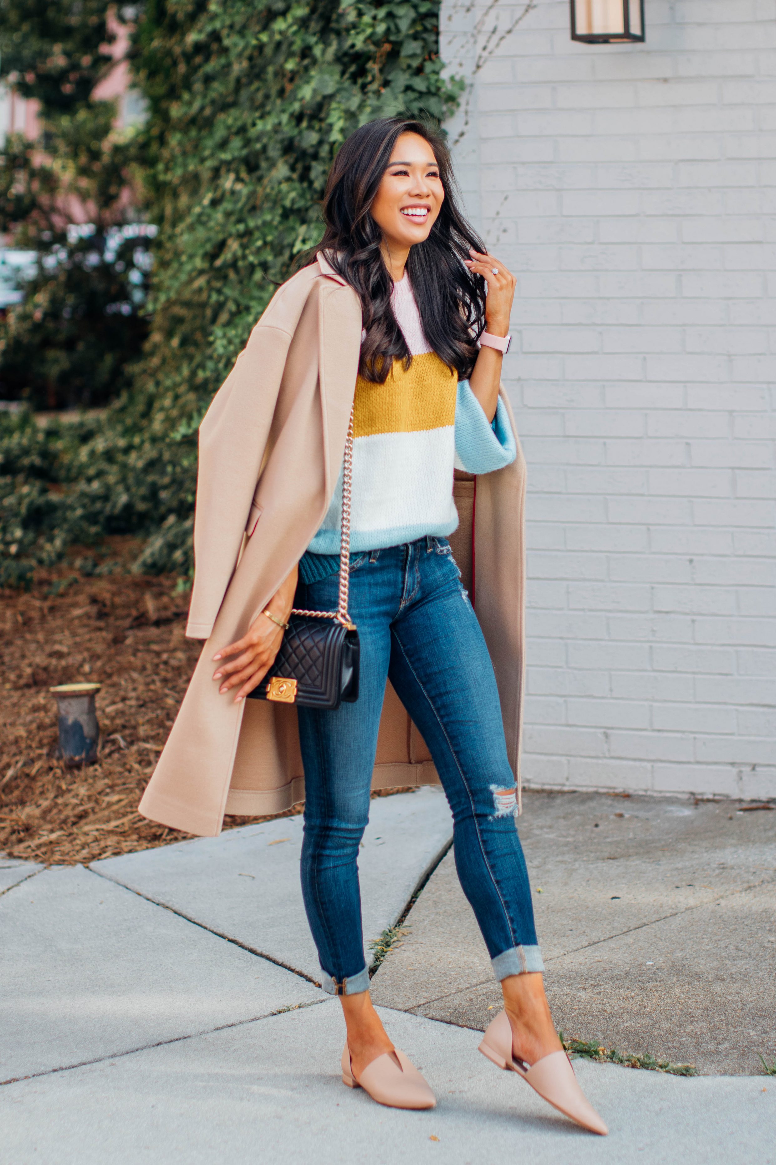 Blogger Hoang-Kim wears a striped Topshop sweater with AG Jeans and nude flats for fall