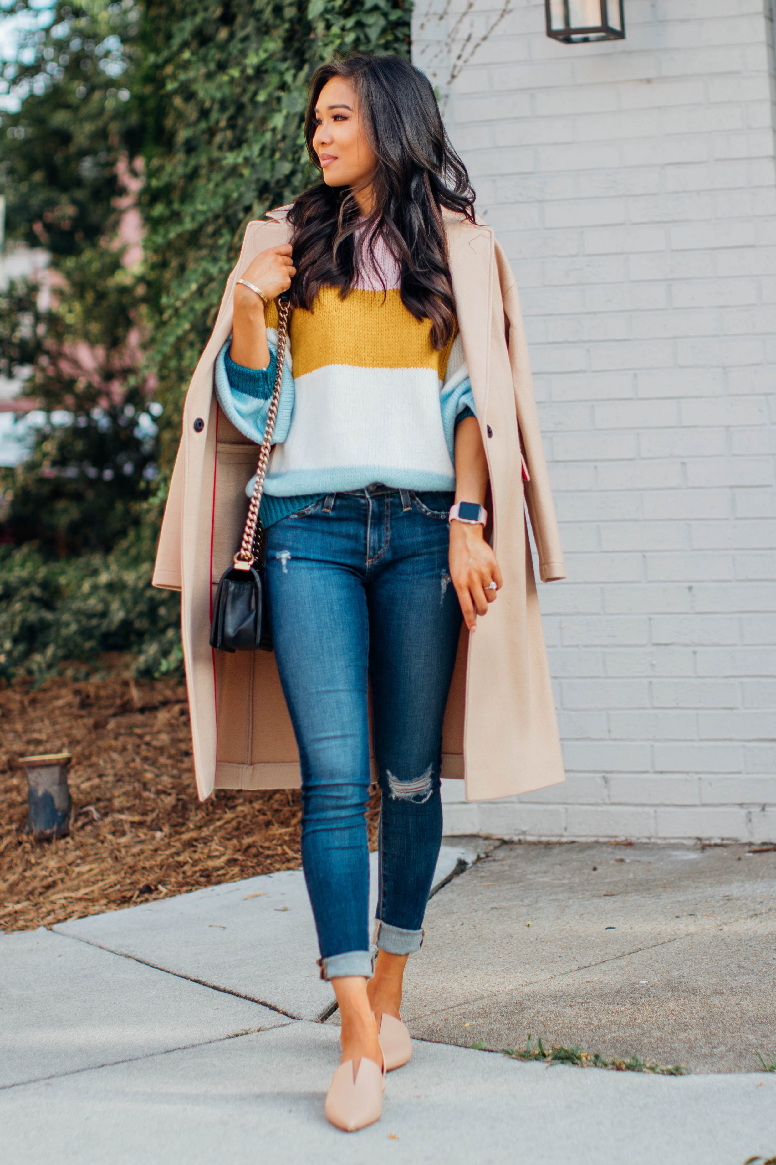 Blogger Hoang-Kim wears a Topshop striped transition sweater for fall