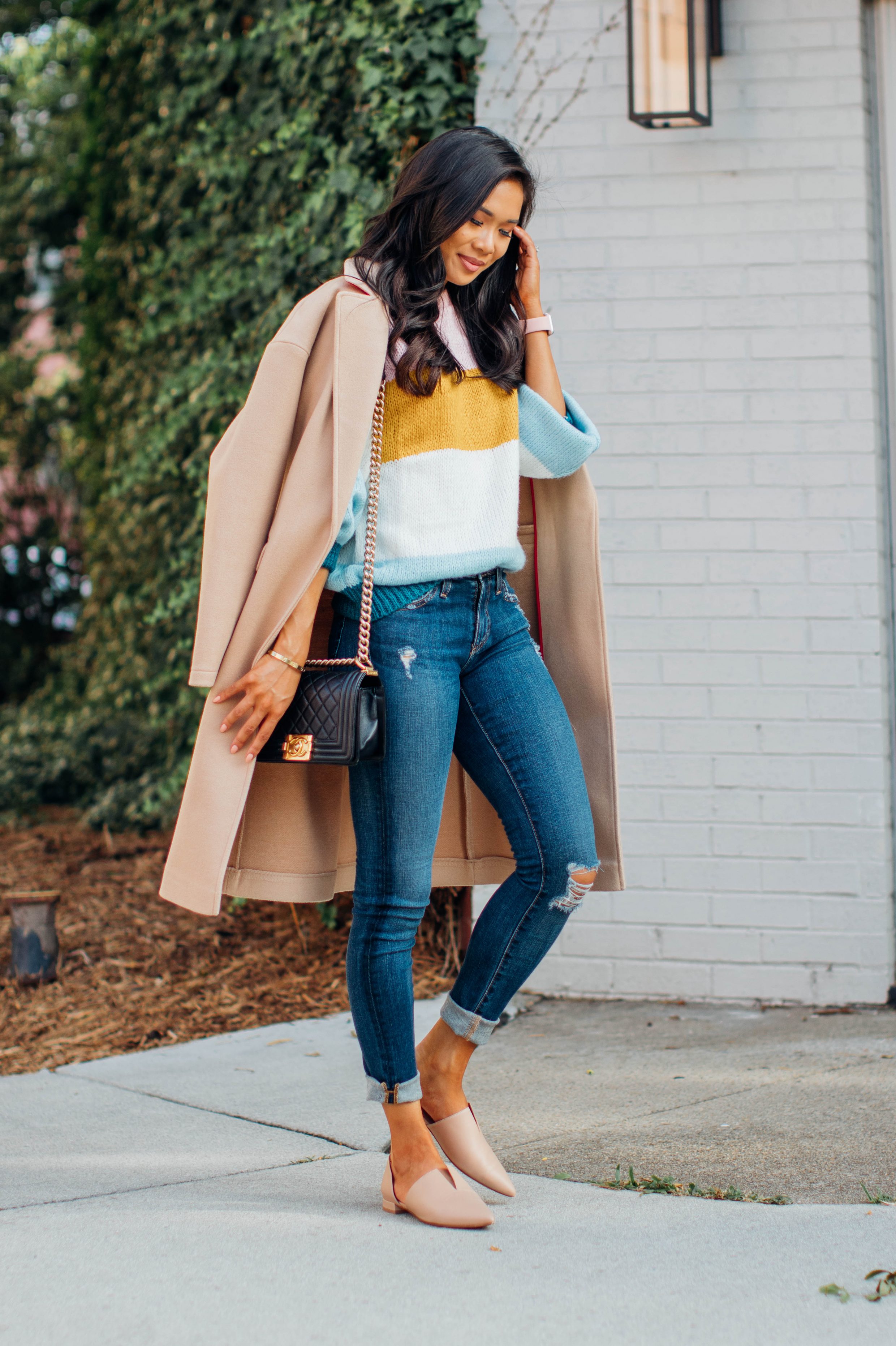 Blogger Hoang-Kim wears a striped Topshop sweater with AG Jeans and nude flats for fall